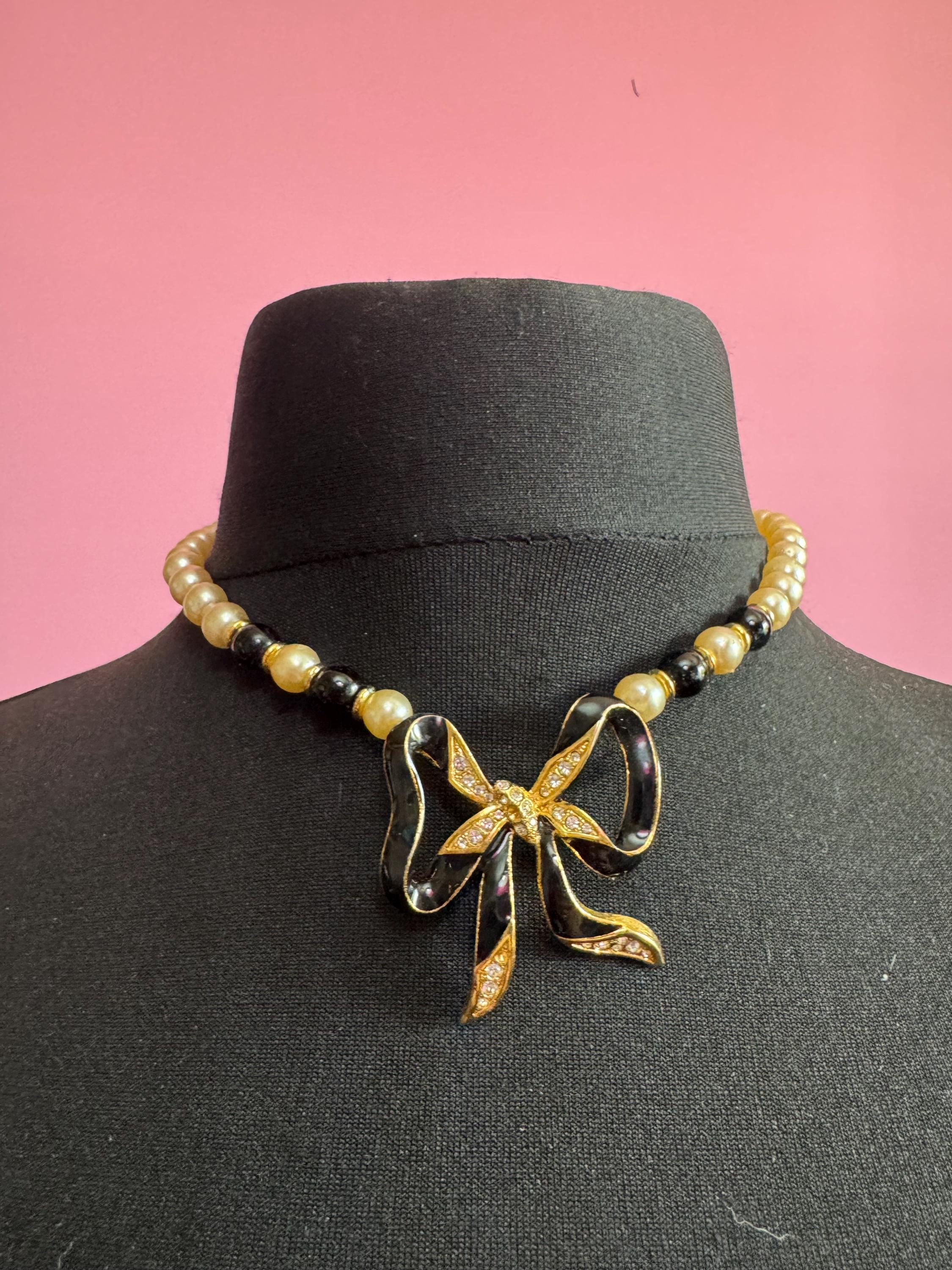 Signed Sphinx cream glass beaded diamanté necklace with classic black ribbon bow detail