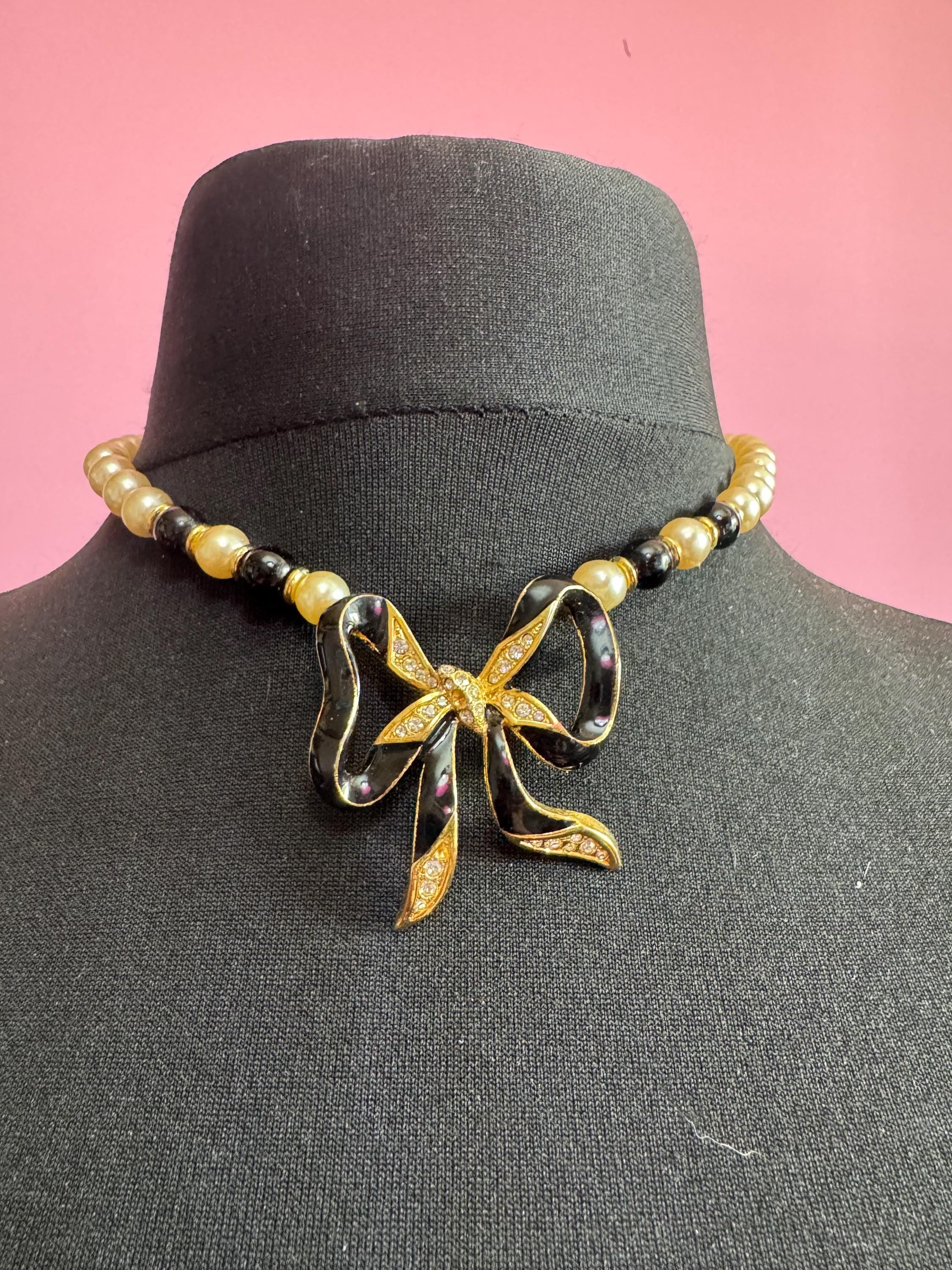 Signed Sphinx cream glass beaded diamanté necklace with classic black ribbon bow detail