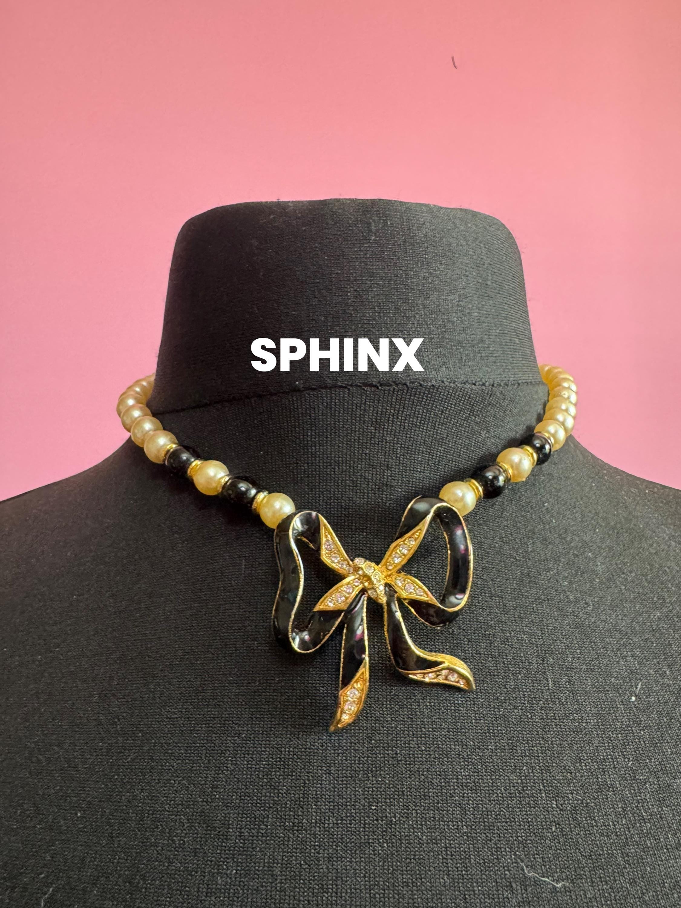 Signed Sphinx cream glass beaded  diamanté necklace with classic black ribbon bow detail