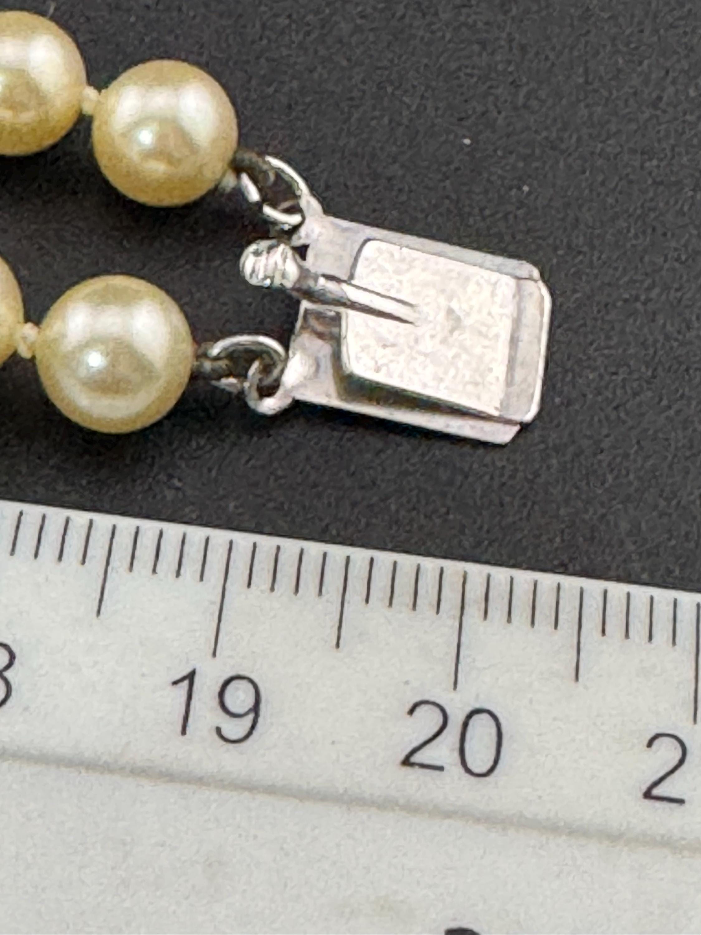 Vintage Sterling 925 Silver knotted faux pearl double row bracelet with ornate clasp with seahorse and starfish logo on