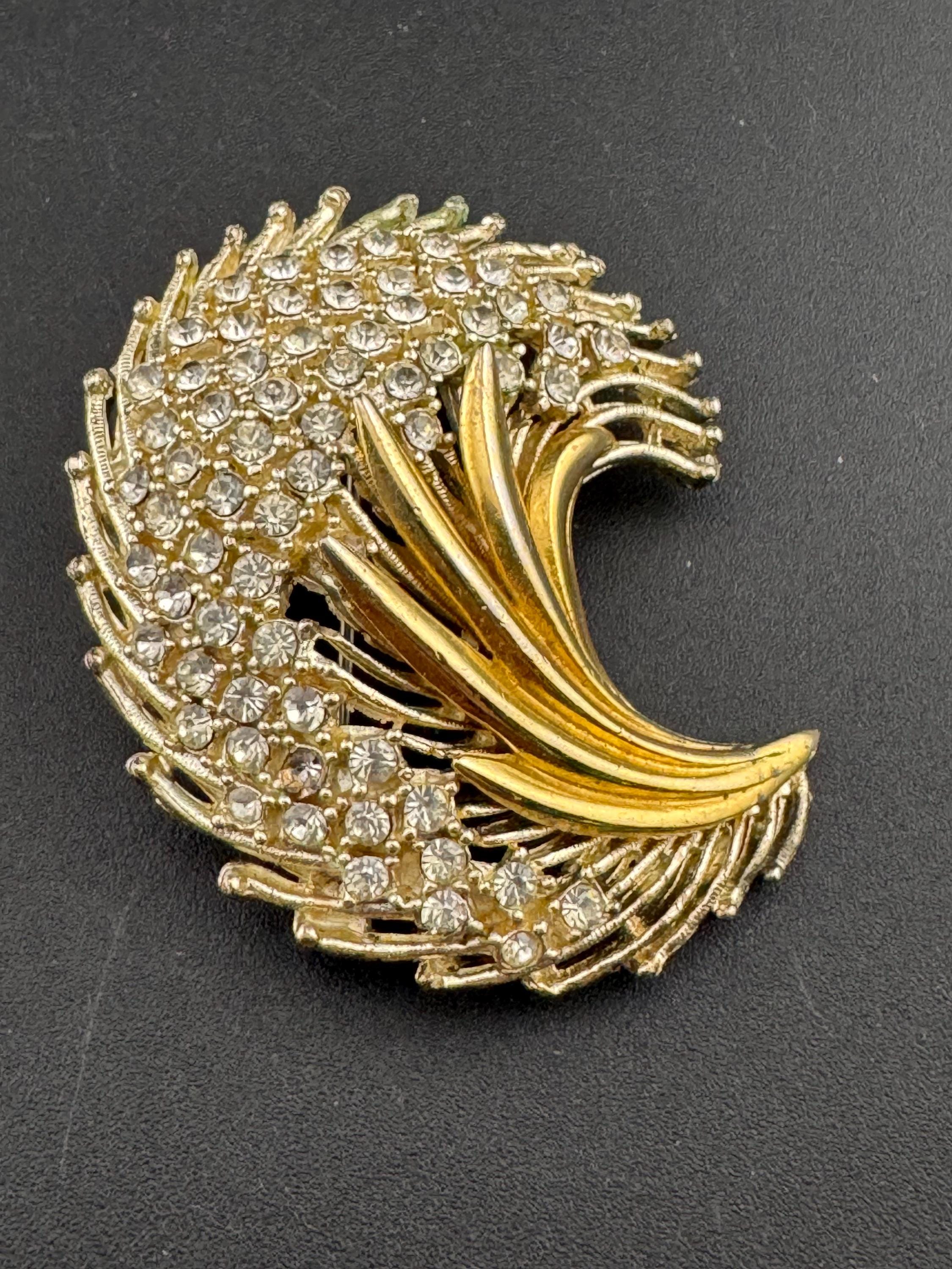 Signed Hollywood gold tone abstract floral feather leaf brooch with clear rhinestones