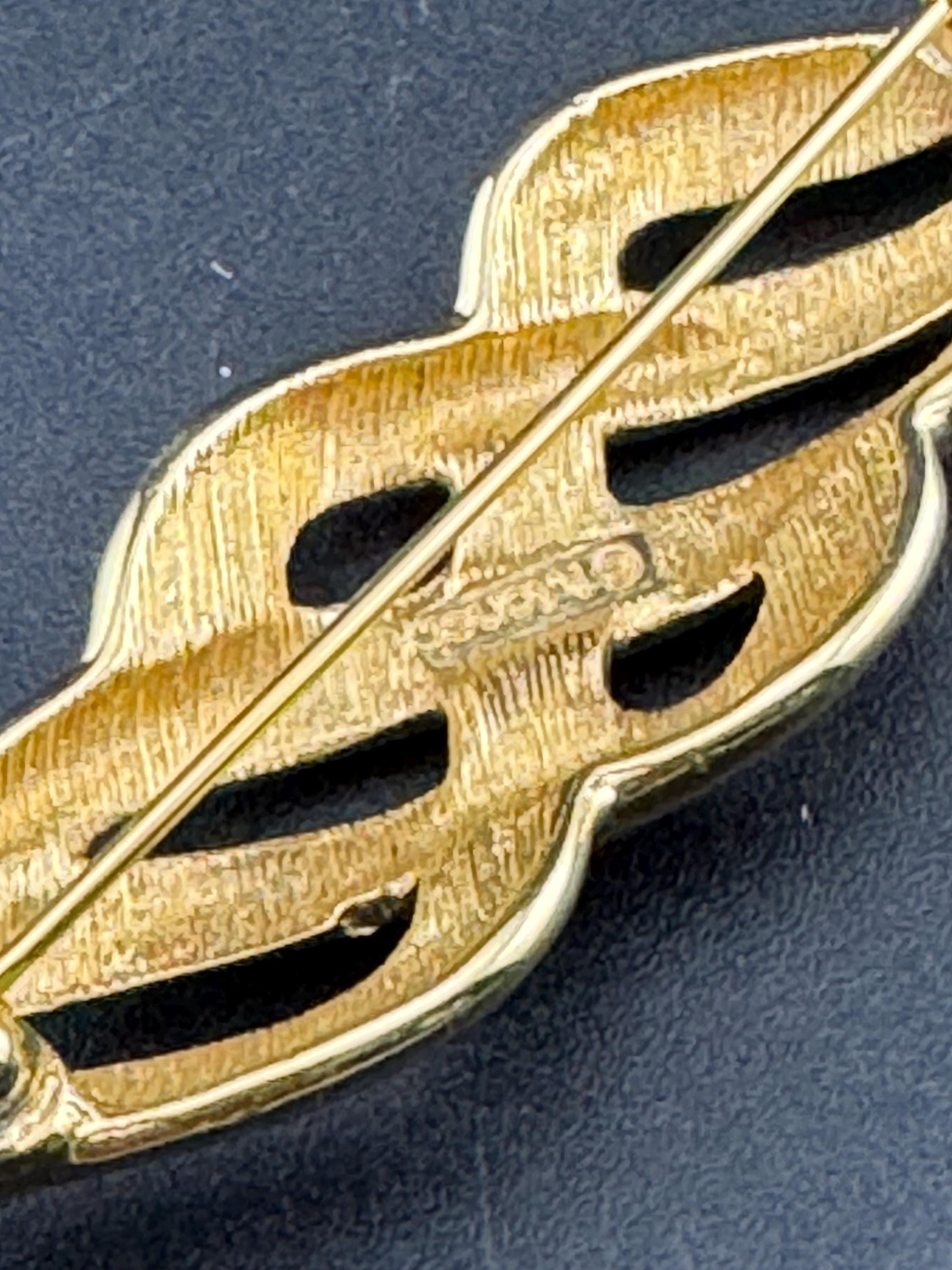 Signed MONET long 8cm gold tone abstract swirl brooch