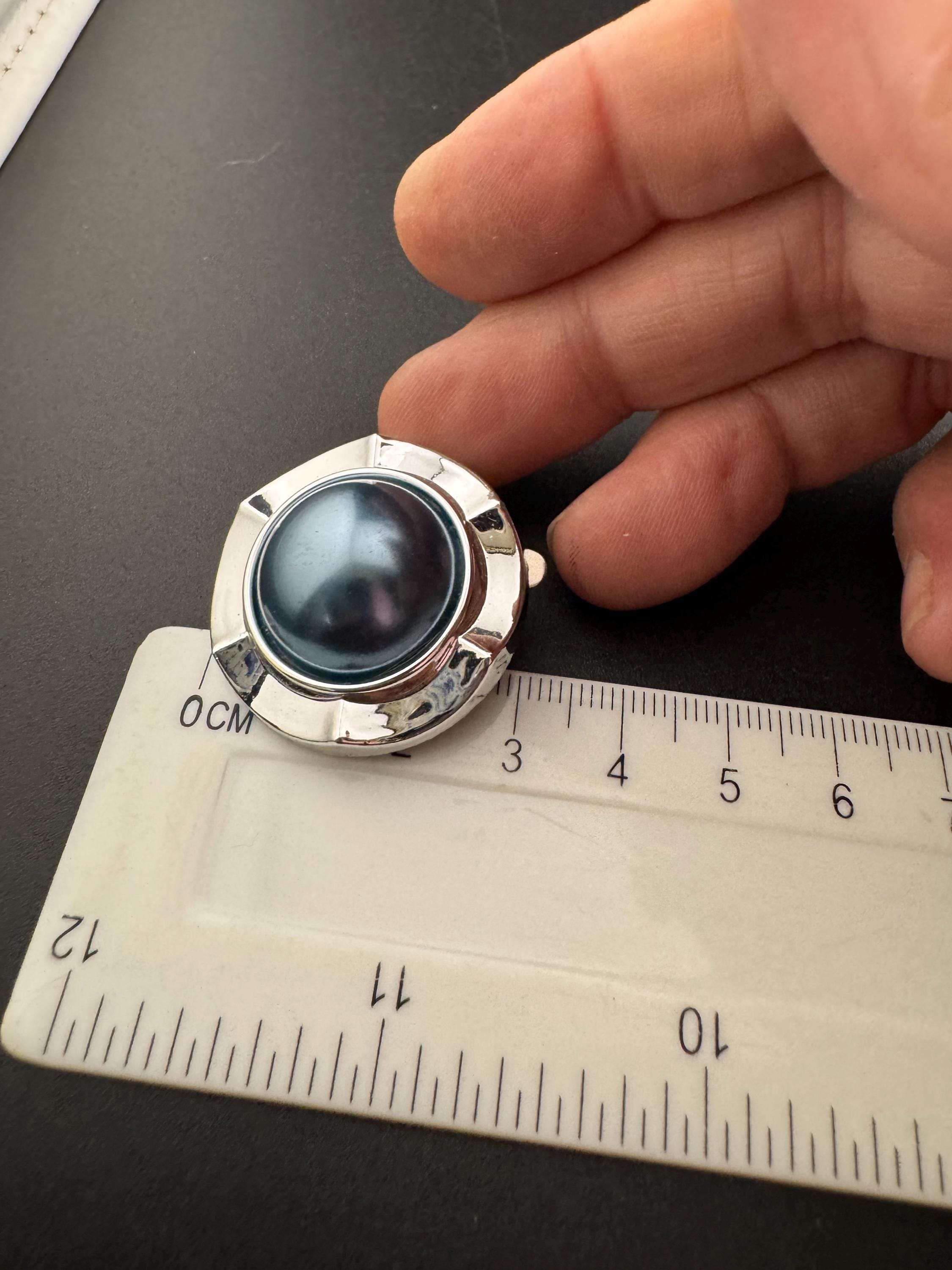 Vintage silver tone metal 2.5cm round clip on domed earrings with central faux grey blue faux pearl cabochons