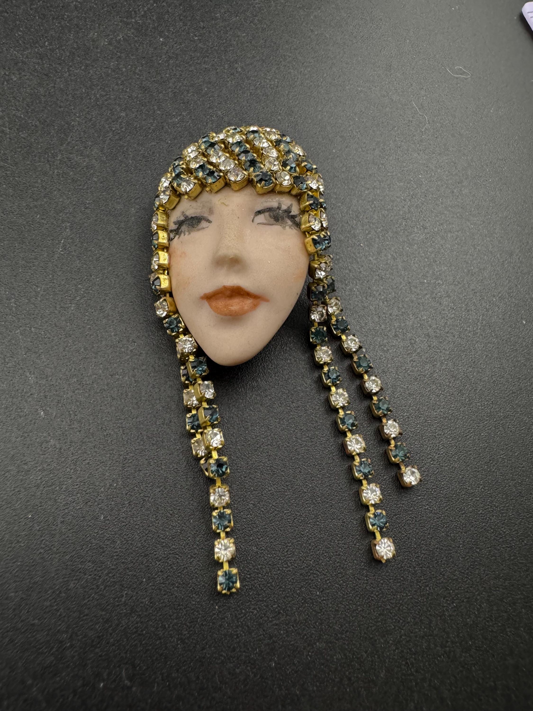 vintage 1980s green emerald  rhinestone flapper girl porcelain ladies face drop brooch