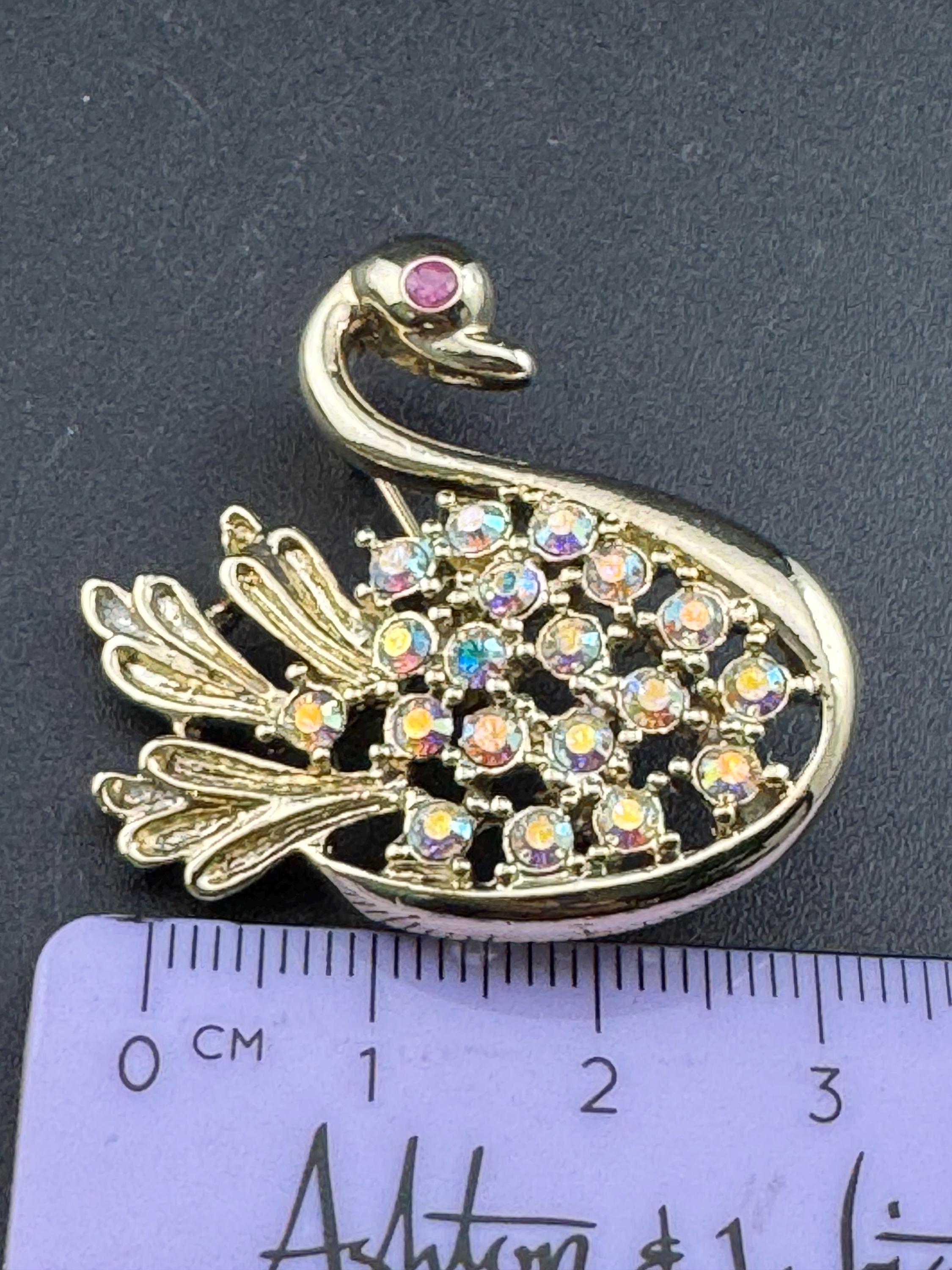 Signed JJI minimalist stylised Aurora borealis AB diamanté swan brooch gold tone