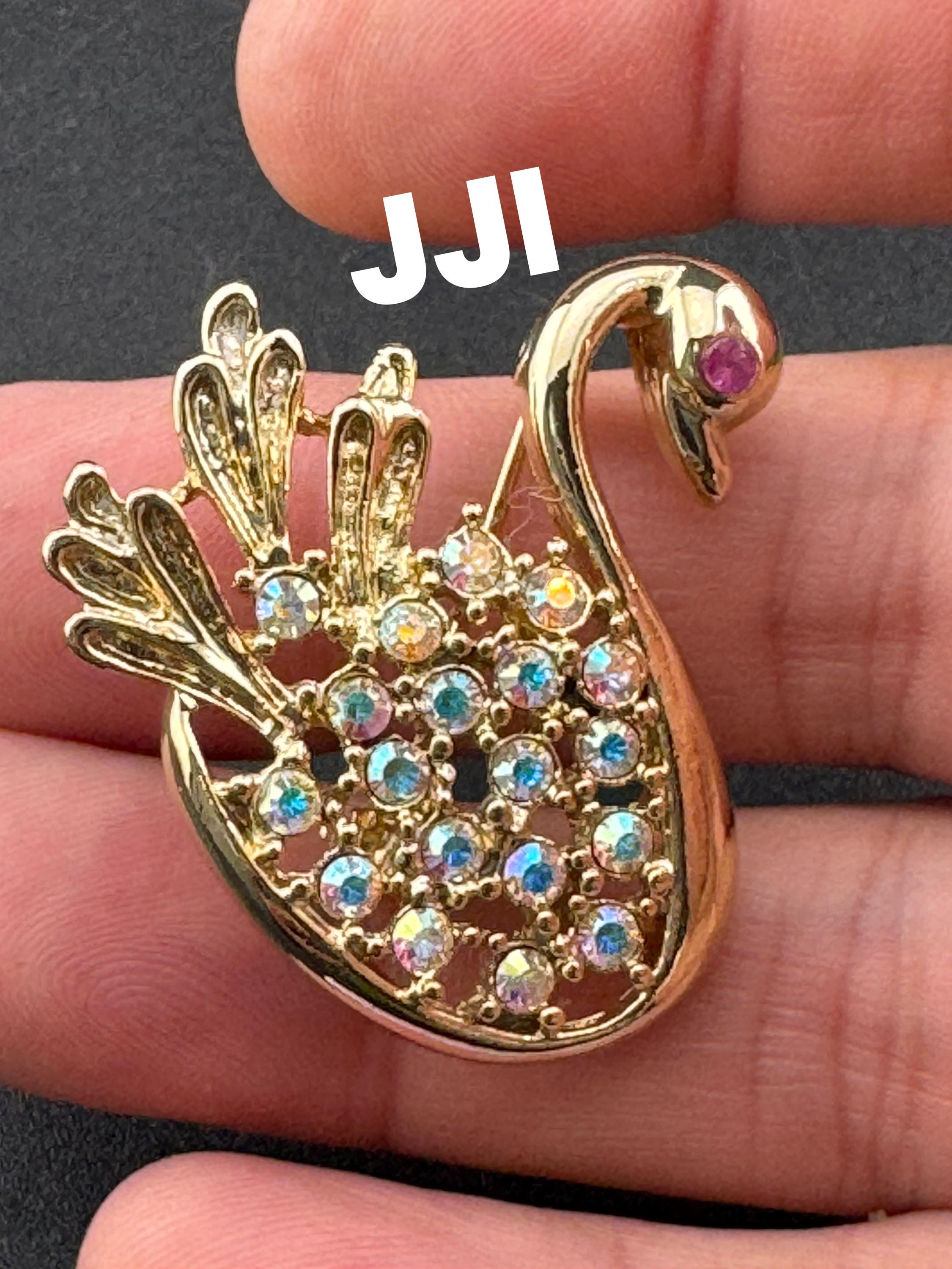 Signed JJI minimalist stylised Aurora borealis AB diamanté swan brooch gold tone