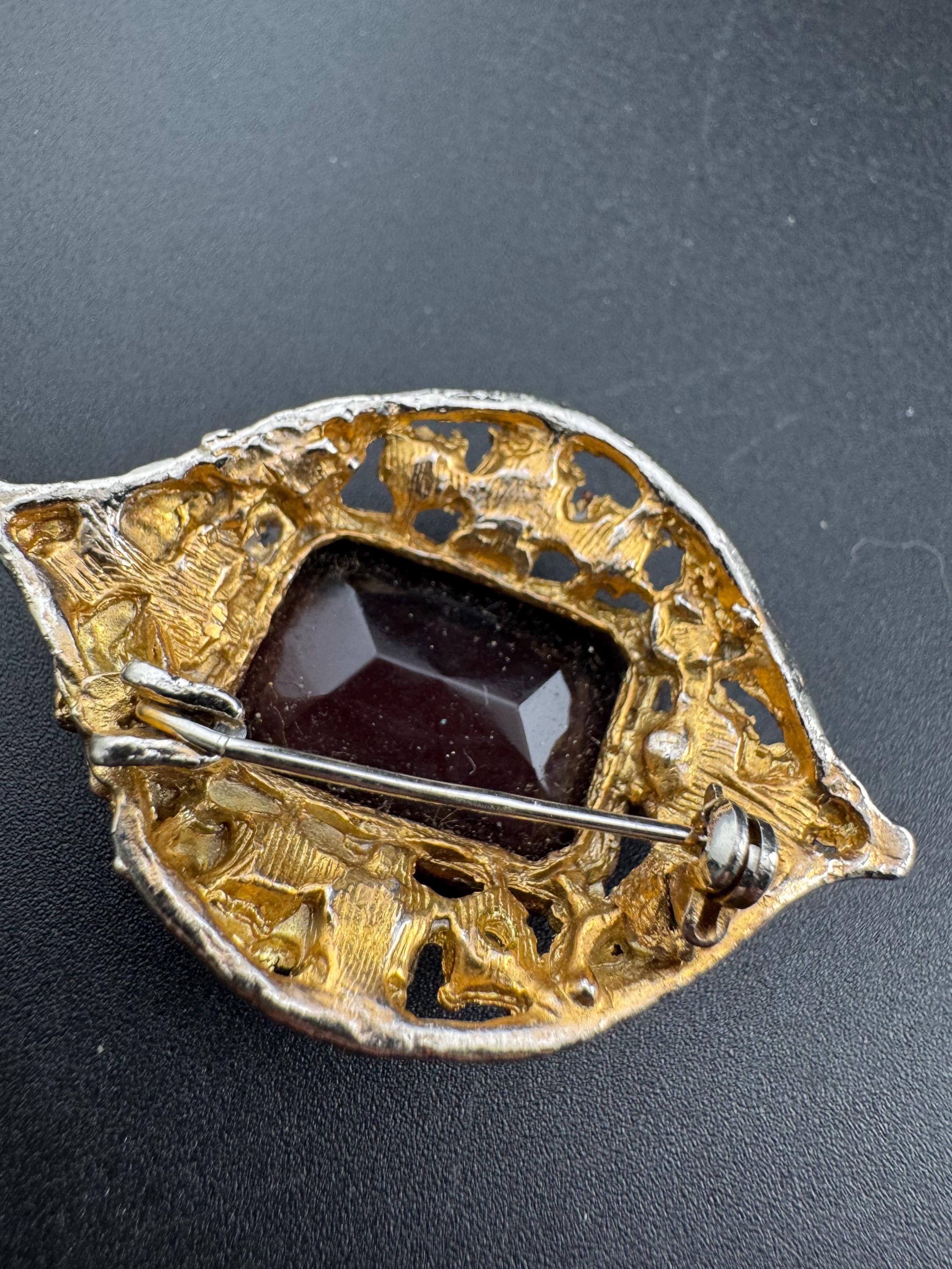 Chunky gold metal brooch with amethyst purple big central rhinestone glass diamanté cabochon