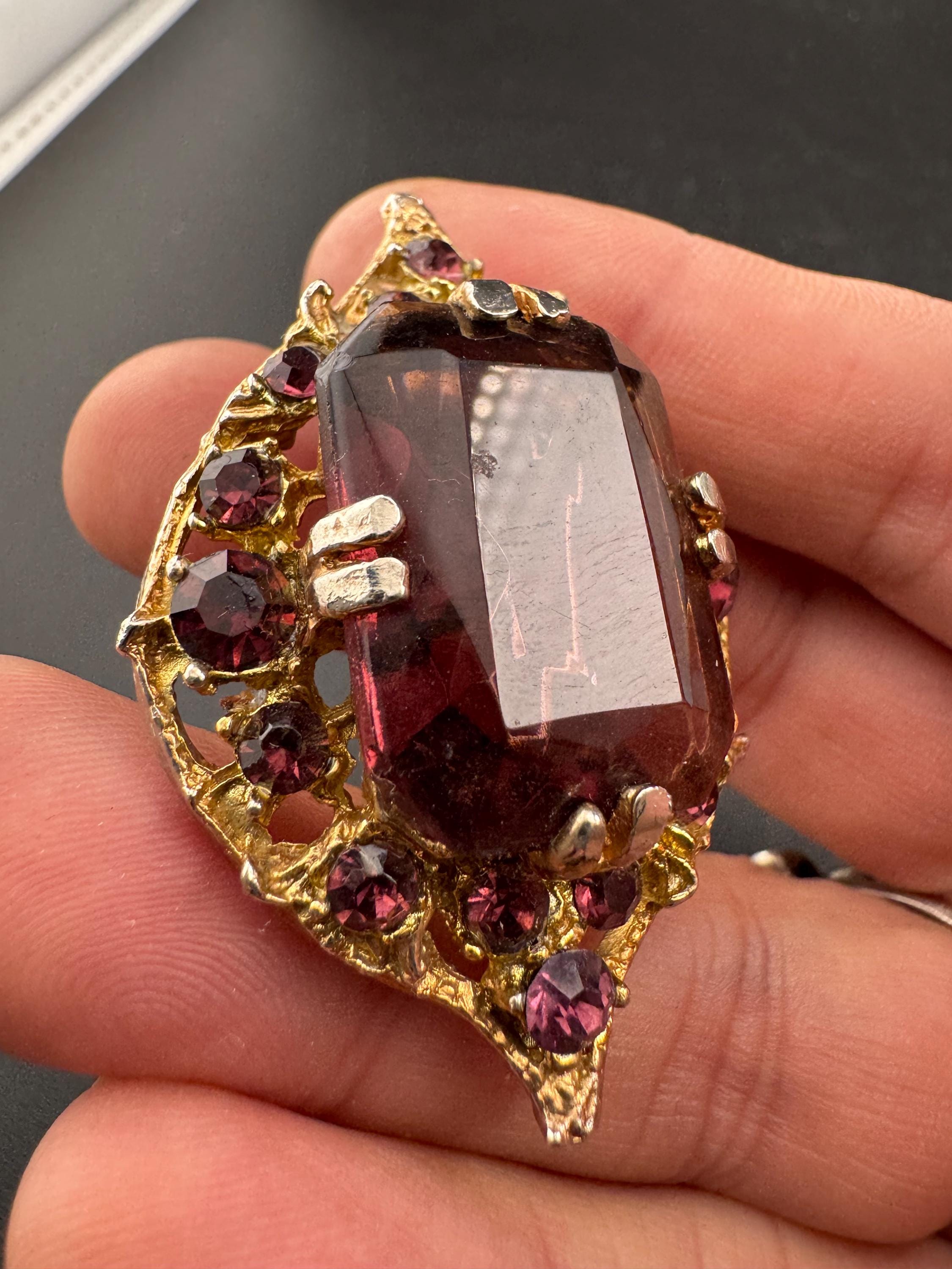 Chunky gold metal brooch with amethyst purple big central rhinestone glass diamanté cabochon