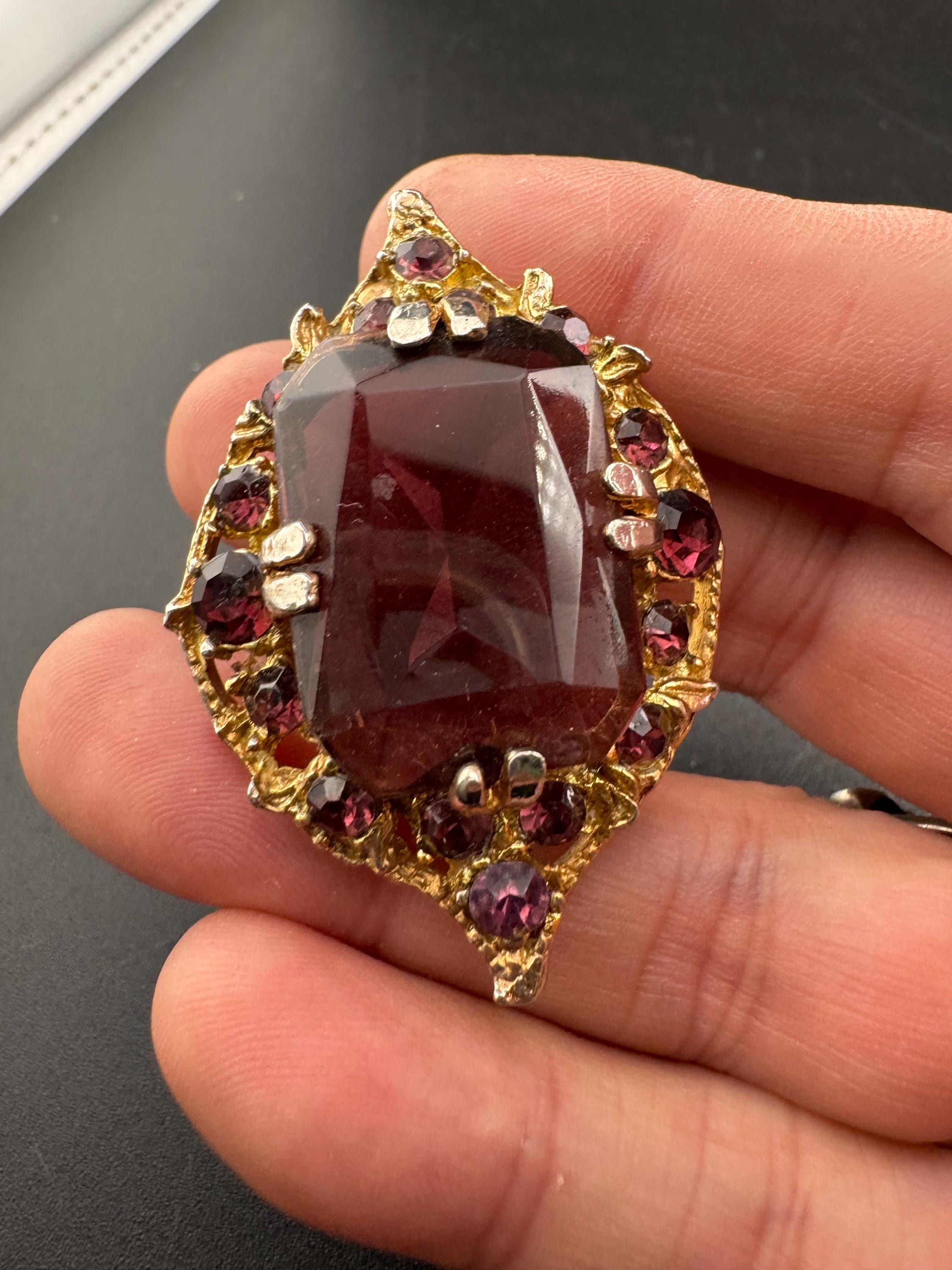 Chunky gold metal brooch with amethyst purple big central rhinestone glass diamanté cabochon