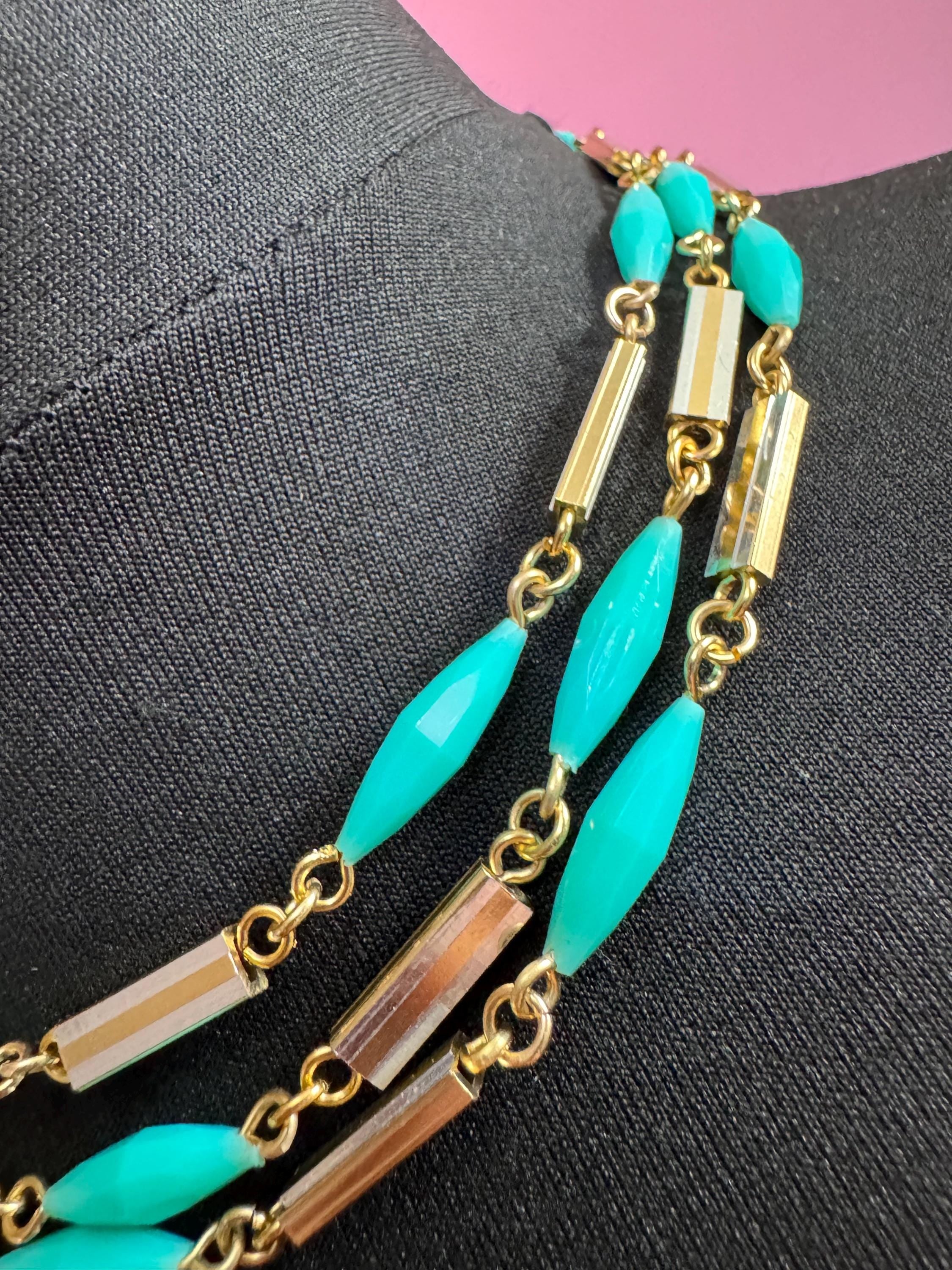 Vintage 60s 70s long plastic layering necklace. Turquoise blue beads with silver and gold tones