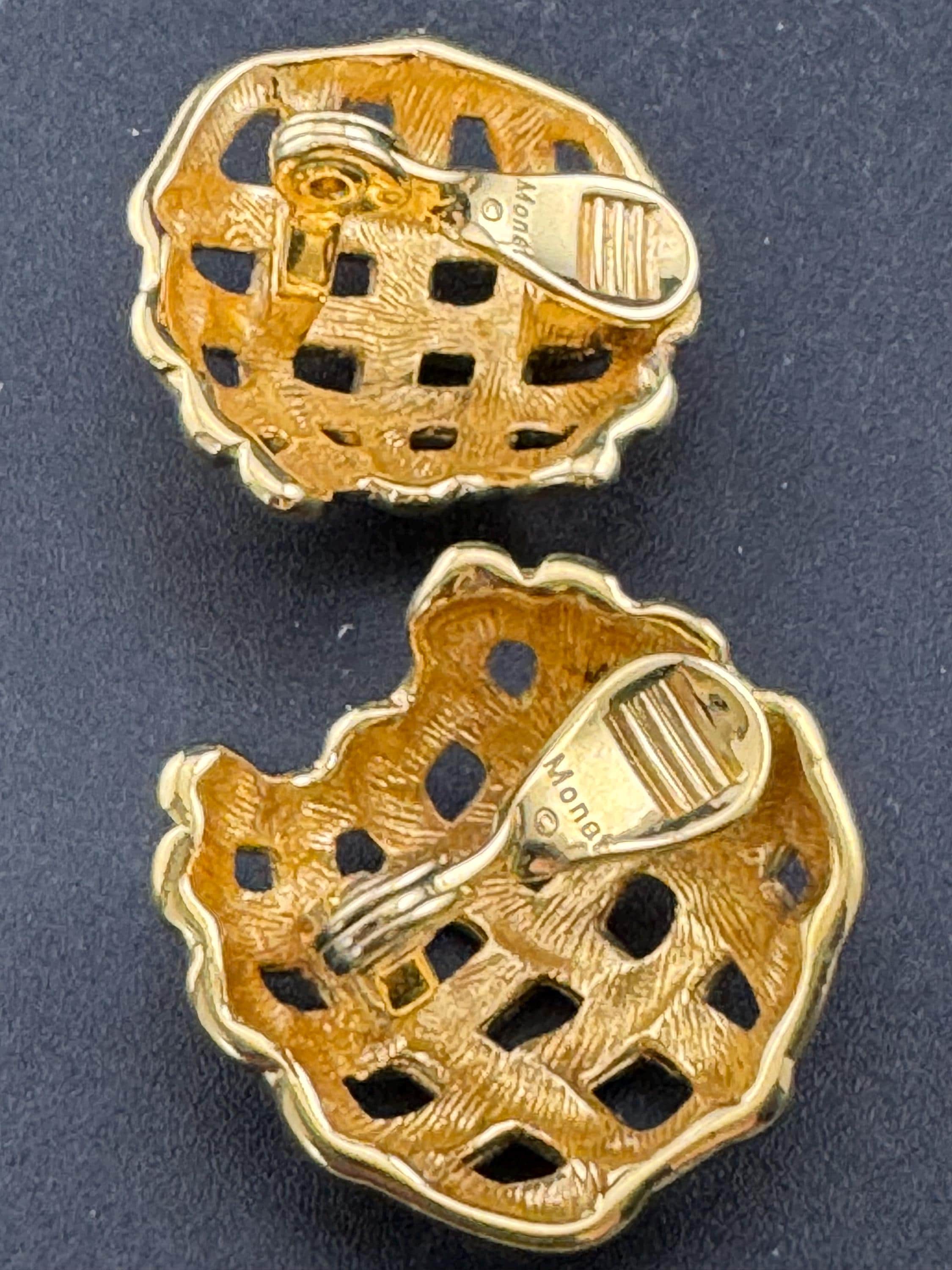 Signed MONET Gold tone textured woven domed basket weave clip on earrings