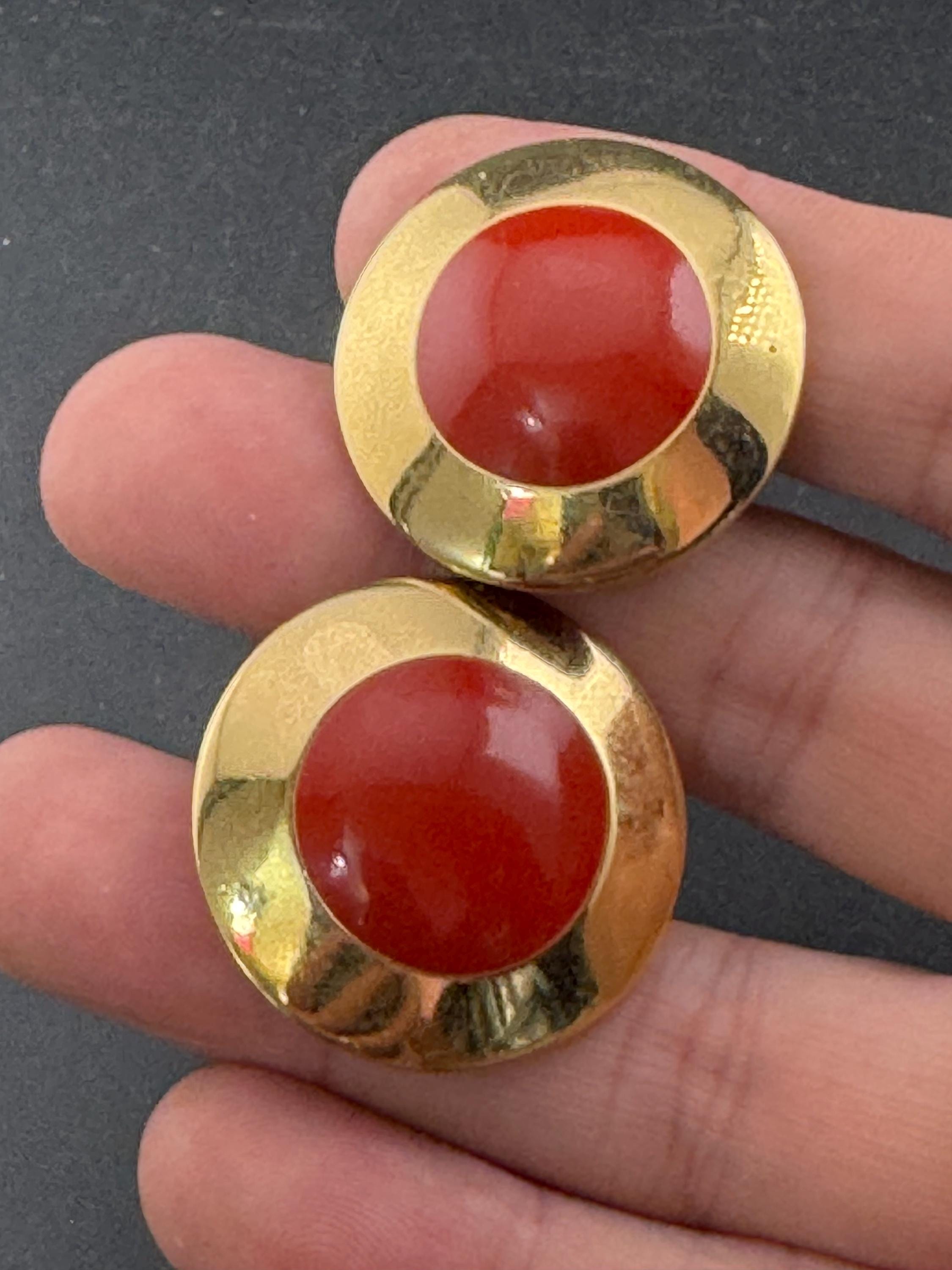 Signed MONET Gold tone deep red enamel low domed disc clip on earrings