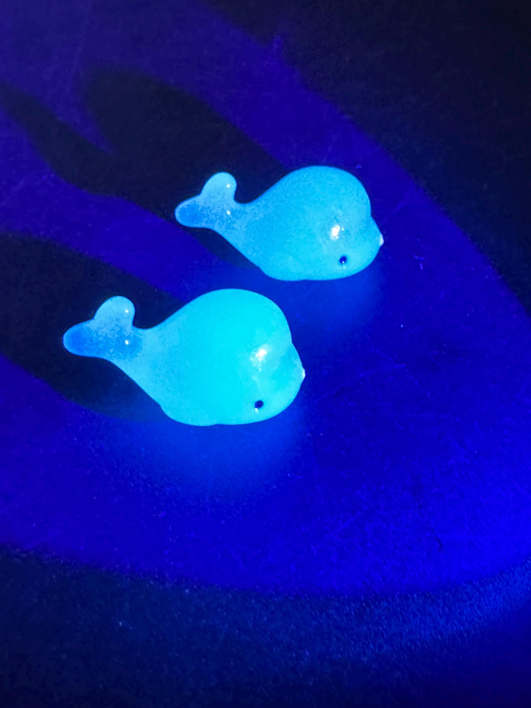 2 pieces of miniature glow in the dark blue sharks seaside cake topper