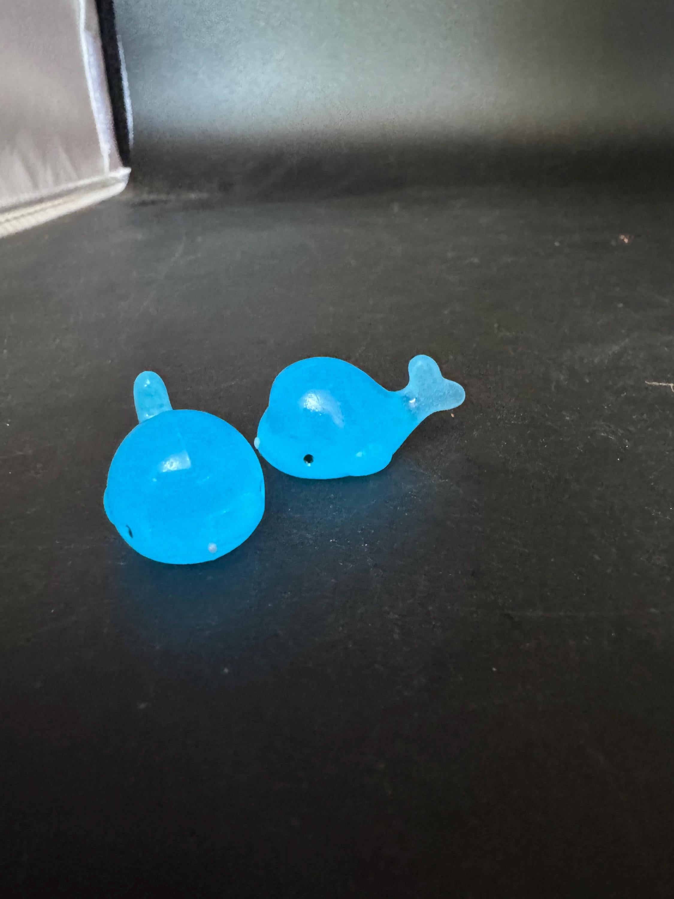 2 pieces of miniature glow in the dark blue sharks seaside cake topper