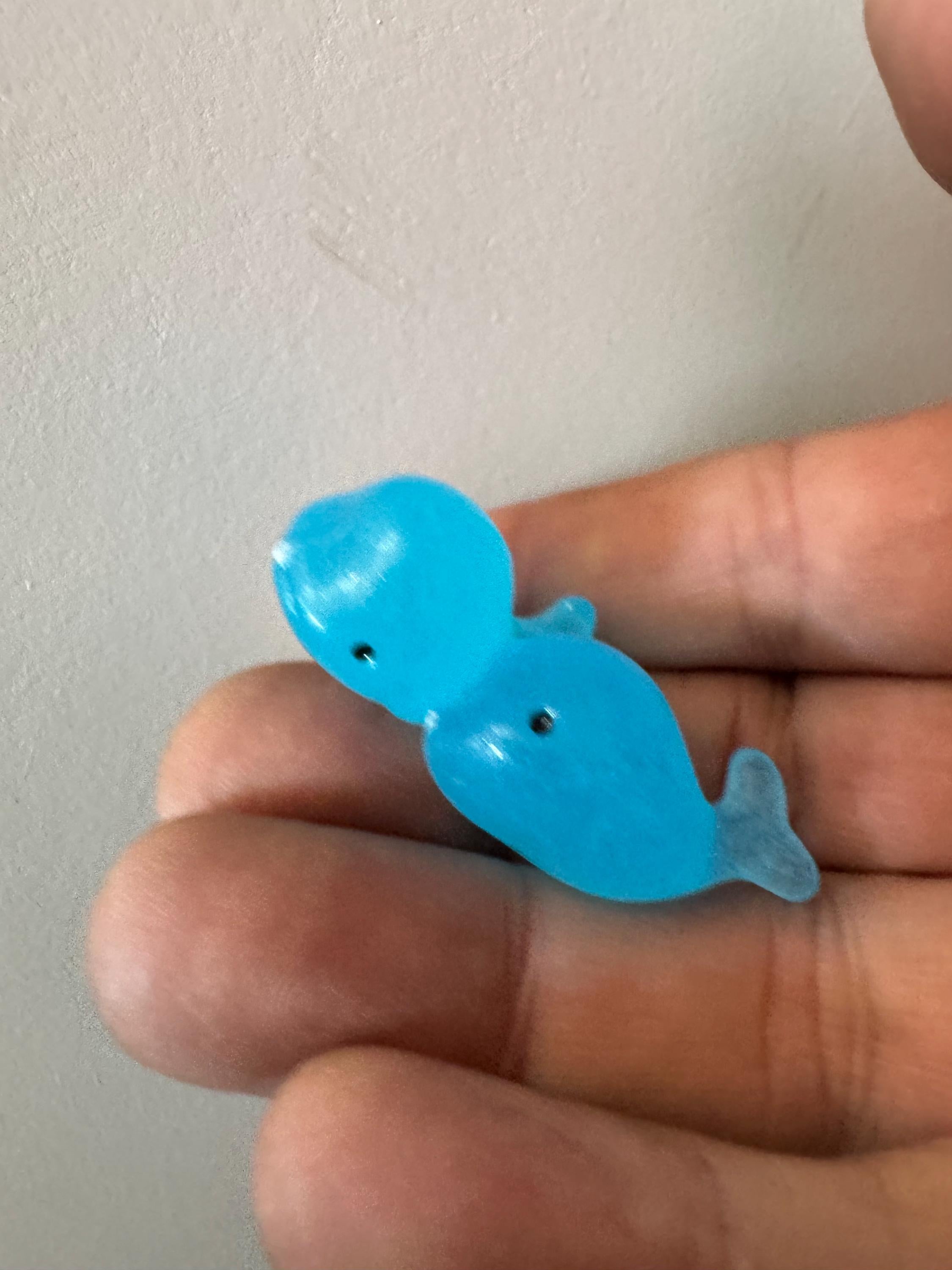 2 pieces of miniature glow in the dark blue sharks seaside cake topper
