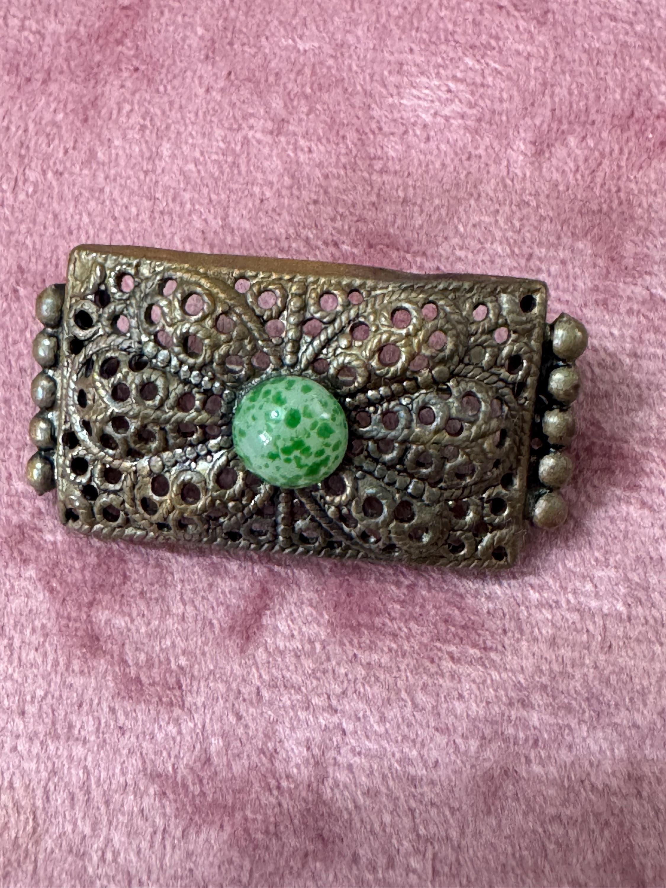 Antique Czech gold tone brass metal Brooch set with a peking glass green cabochon