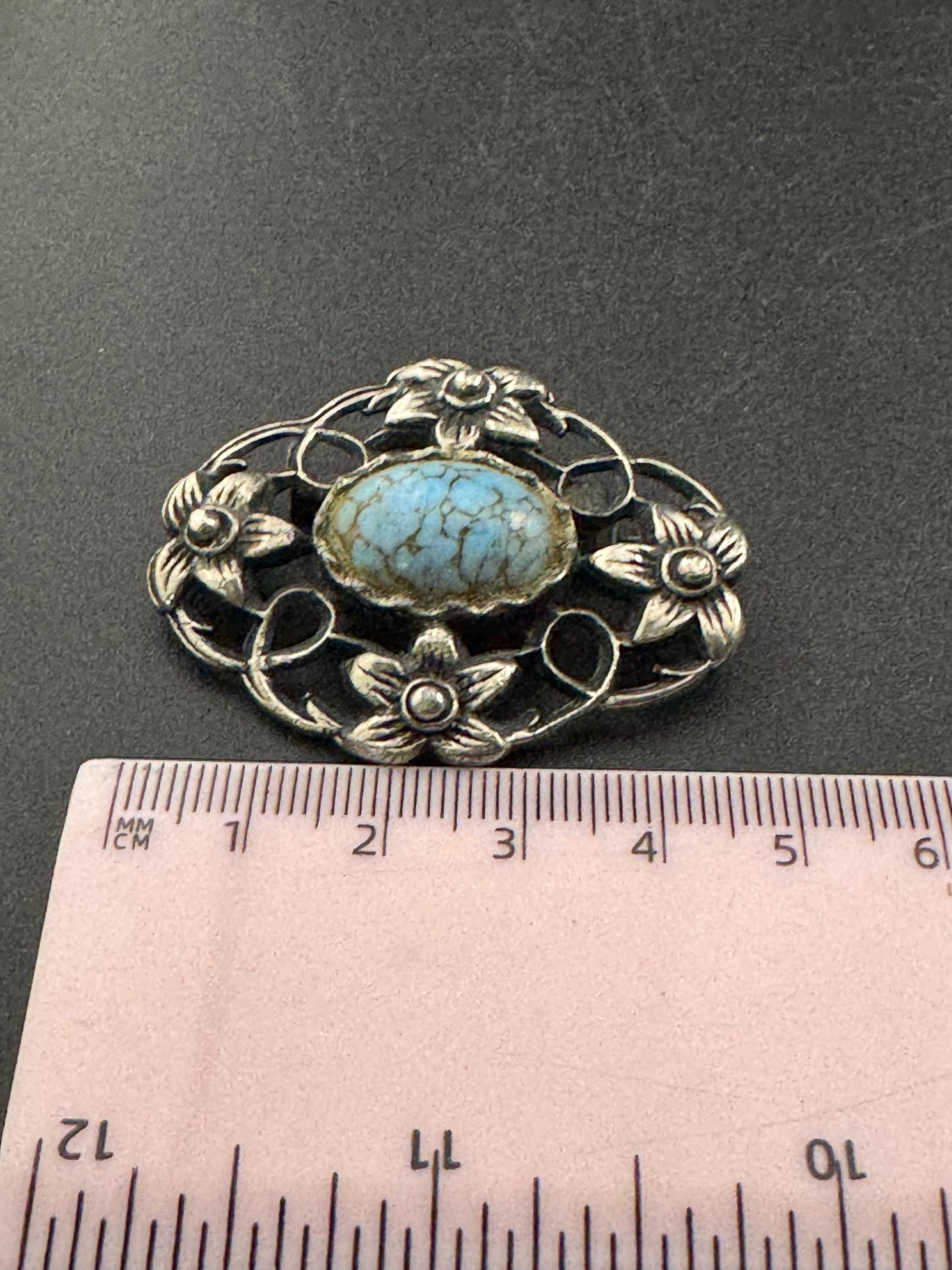 vintage silver tone ornate Scottish style brooch set with turquoise cabochon