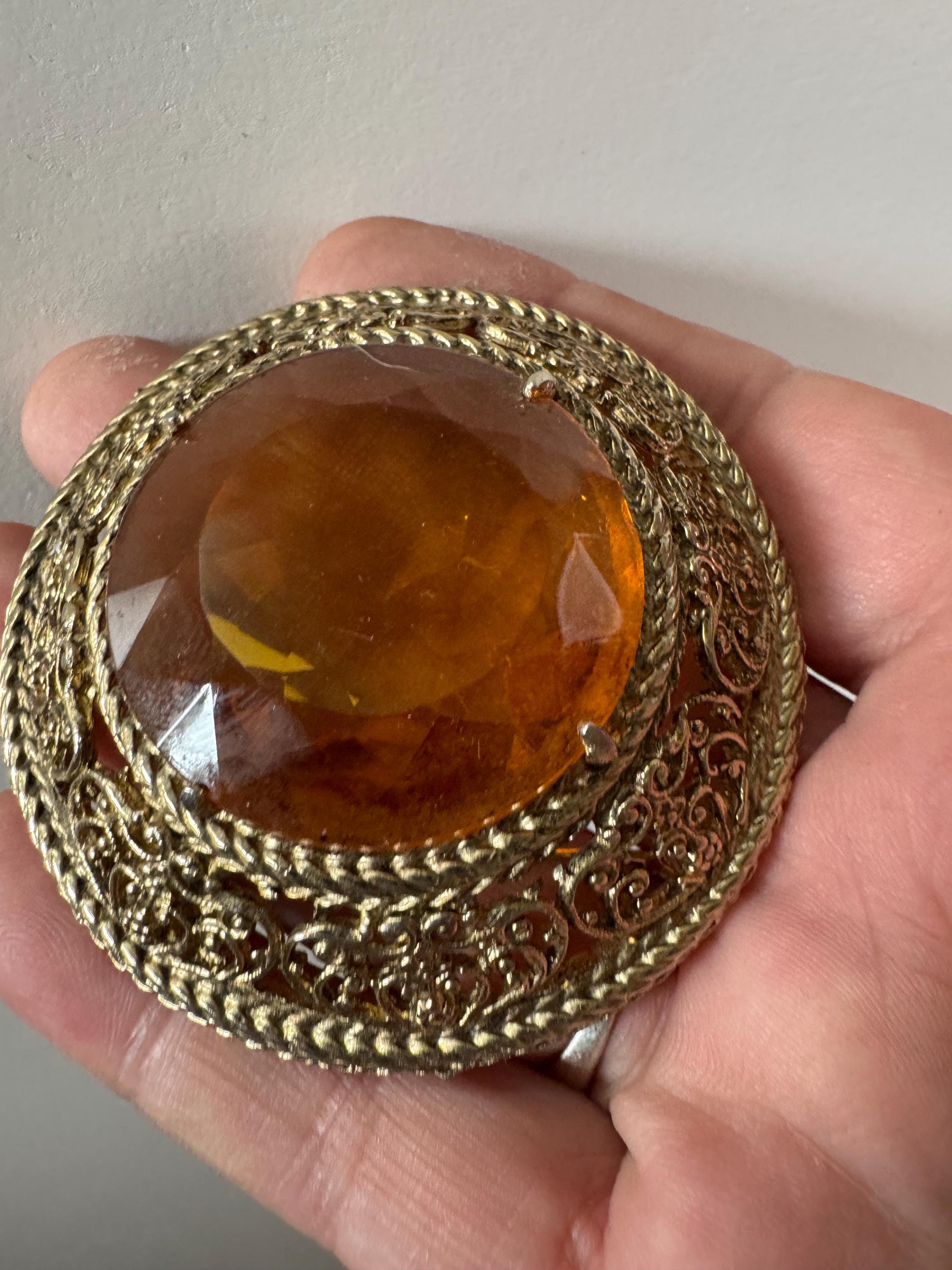 Vintage oversized chunky gold tone brooch with large orange citrine glass cabochon