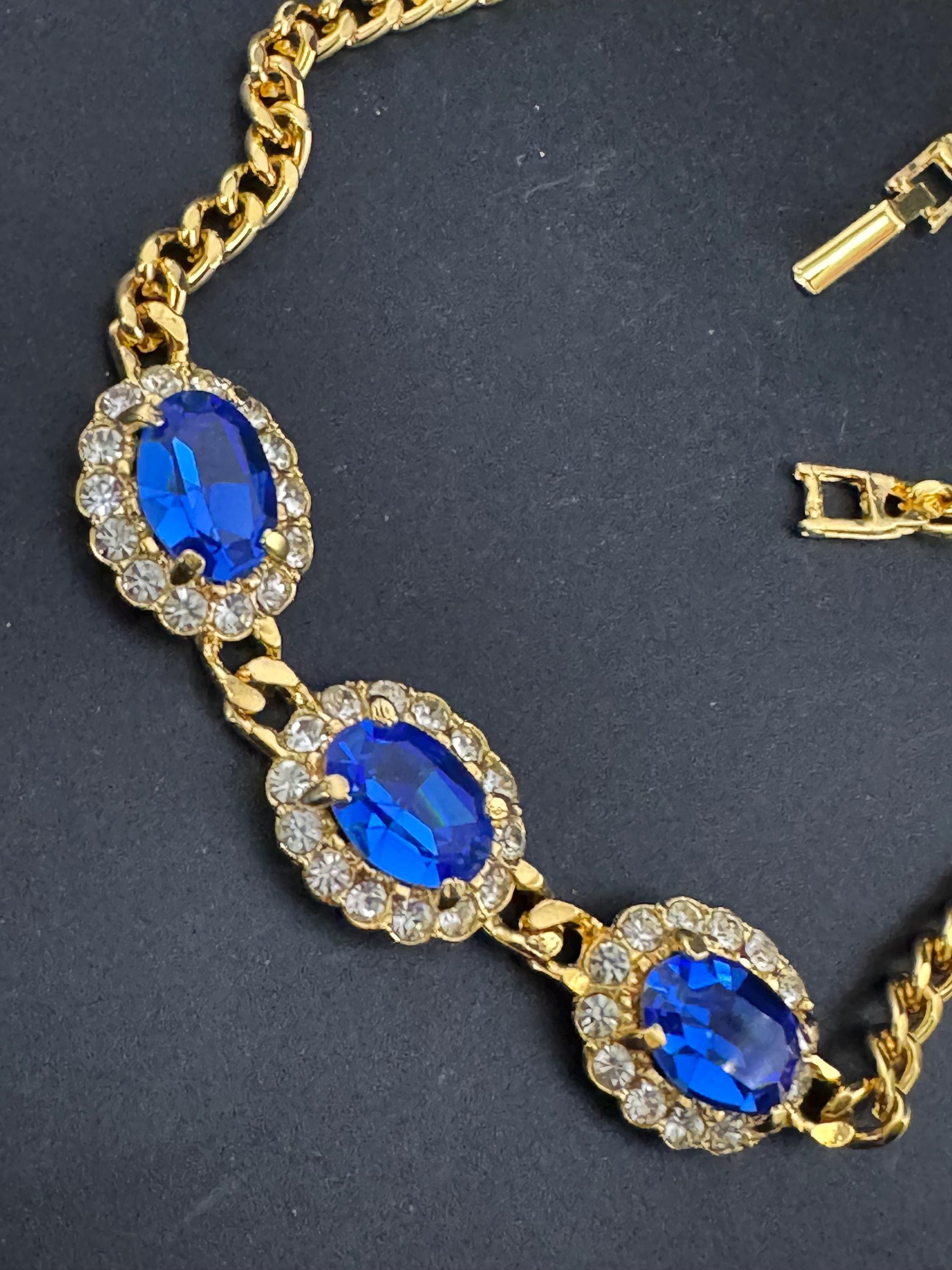 Vintage 1980s Swarovski crystal set triple sapphire blue and clear diamanté oval pendant necklace gold tone high end old shop stock