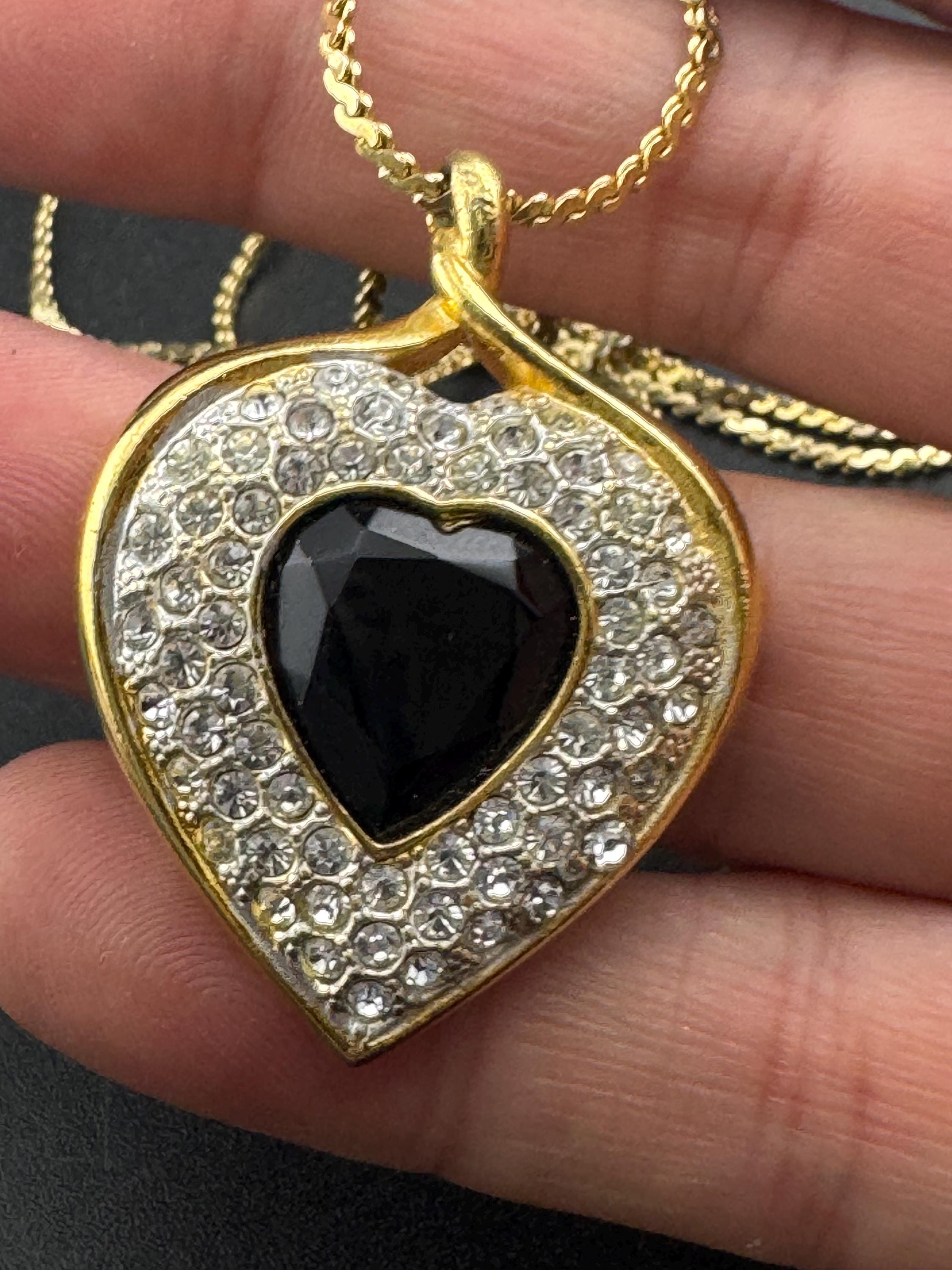 Signed Sphinx black glass crystal love heart diamanté pendant necklace on a long gold plated serpentine chain
