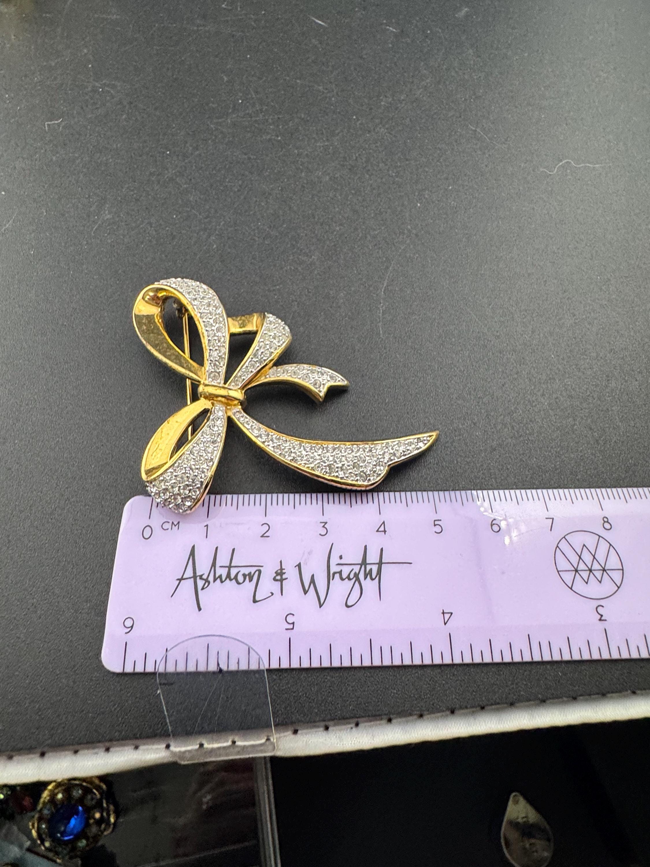 Signed Vintage high end 6cm gold tone clear diamanté bow brooch