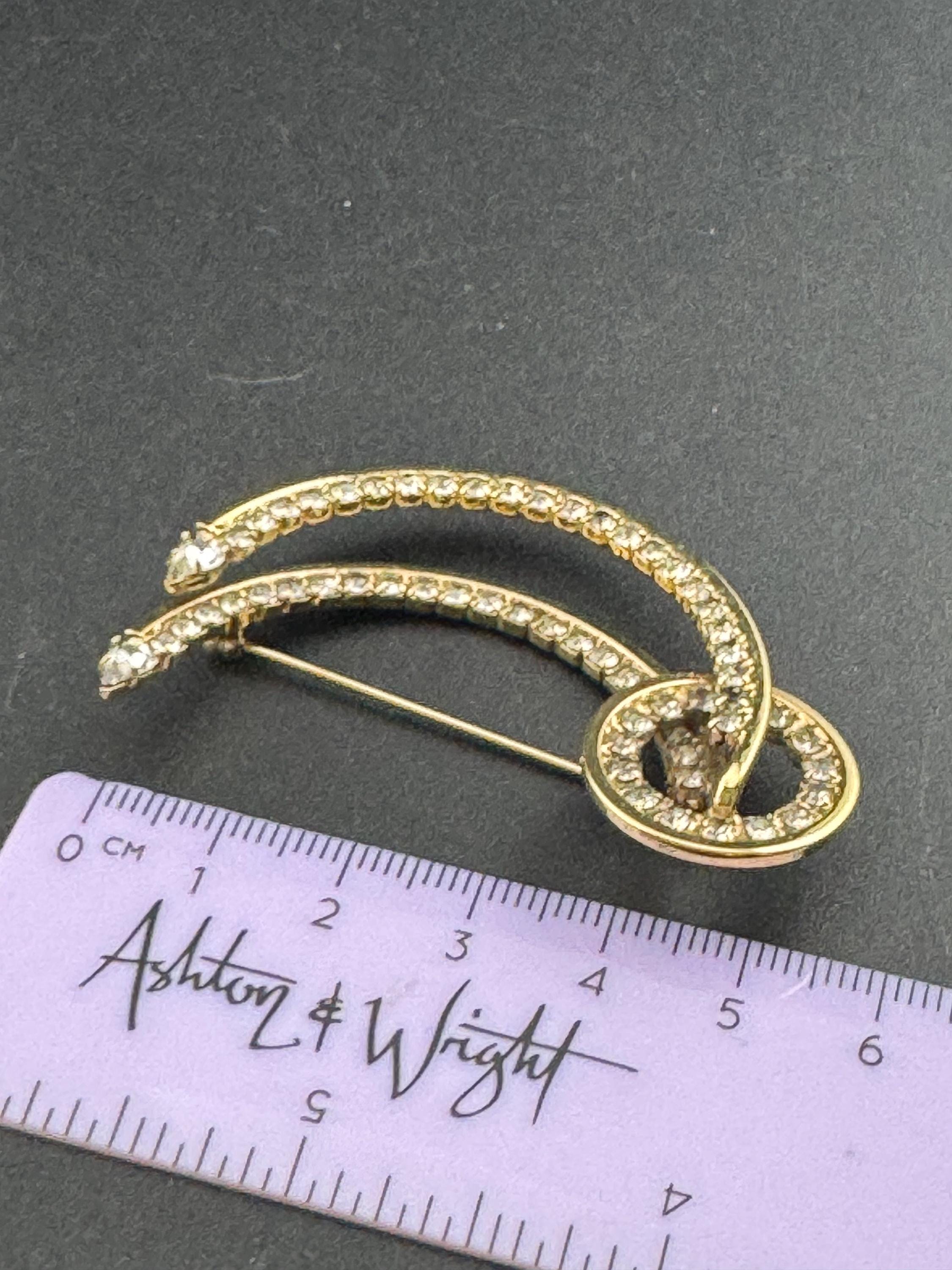 Large vintage stylish gold tone clear diamanté glass abstract swirl brooch
