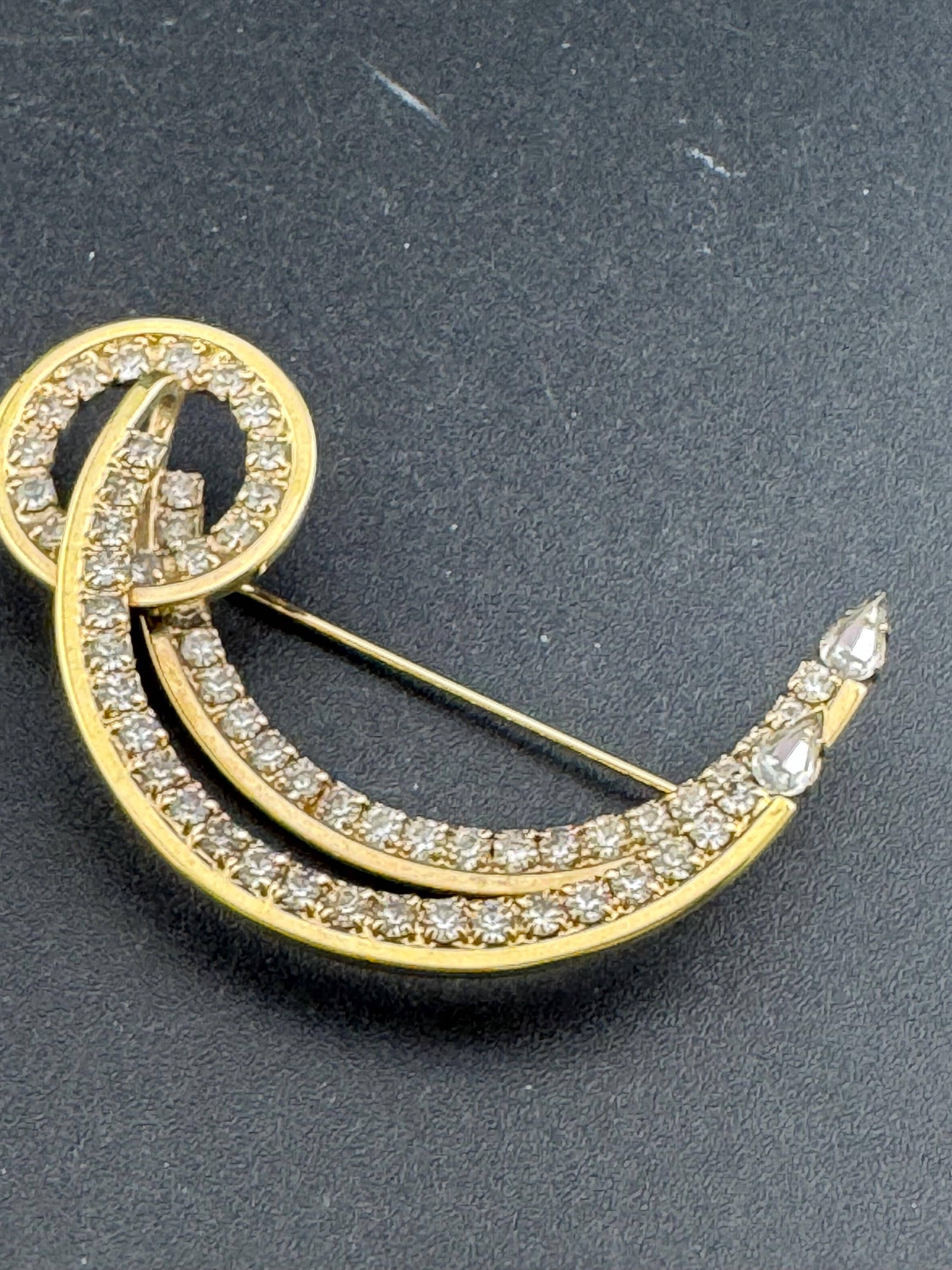 Large vintage stylish gold tone clear diamanté glass abstract swirl brooch