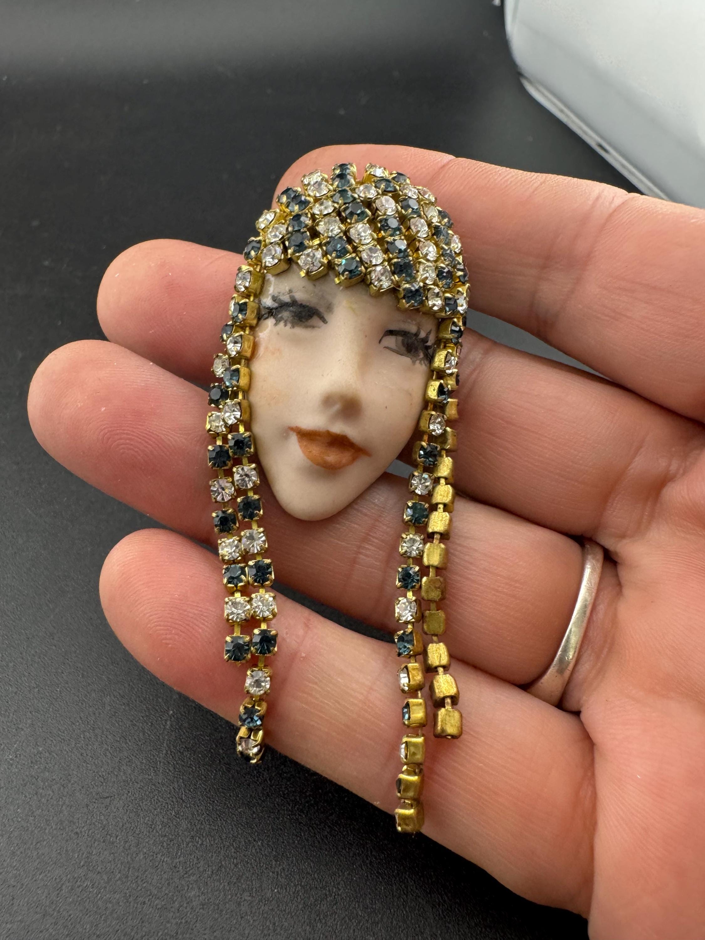 vintage 1980s green emerald  rhinestone flapper girl porcelain ladies face drop brooch