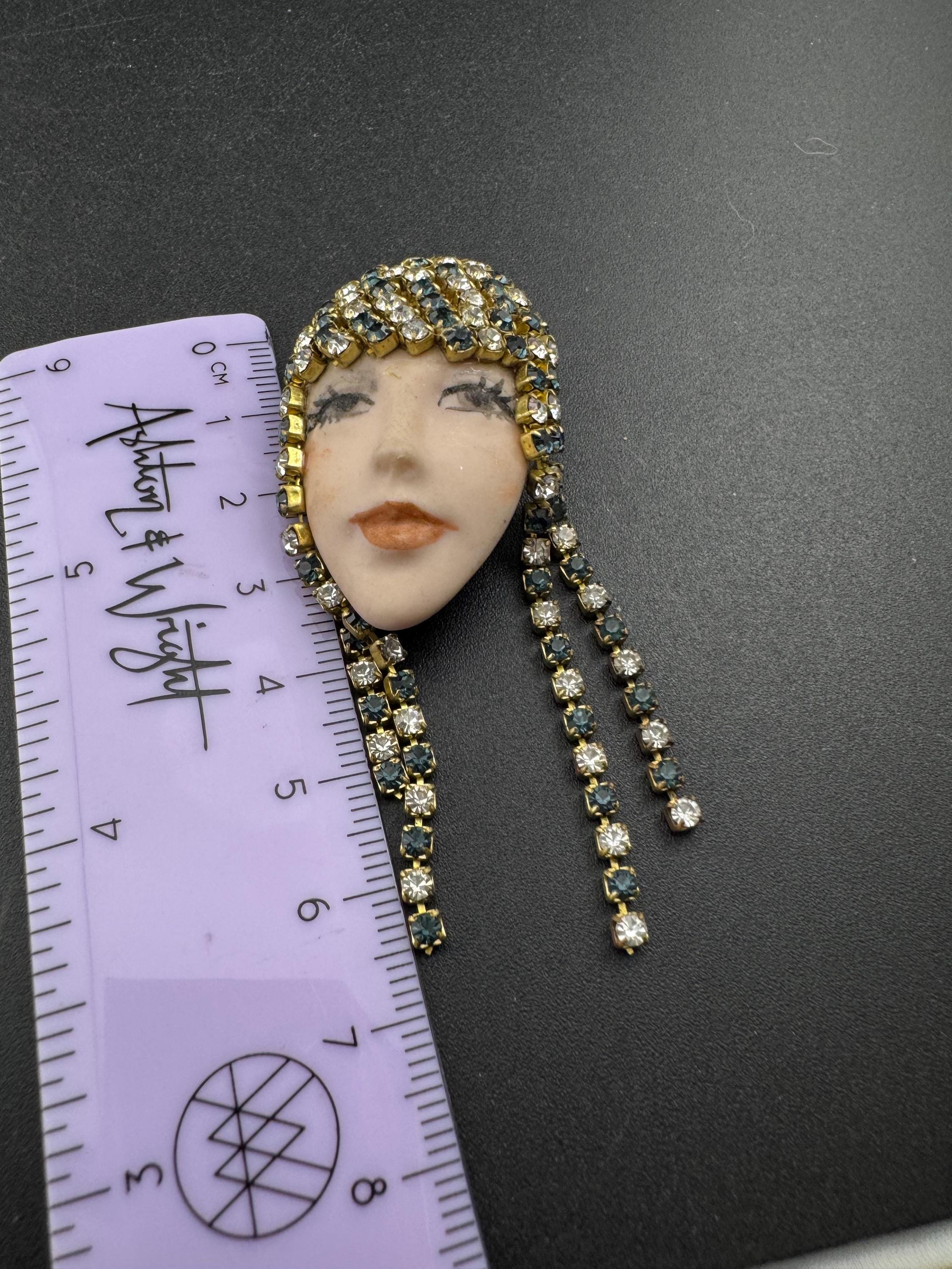 vintage 1980s green emerald  rhinestone flapper girl porcelain ladies face drop brooch