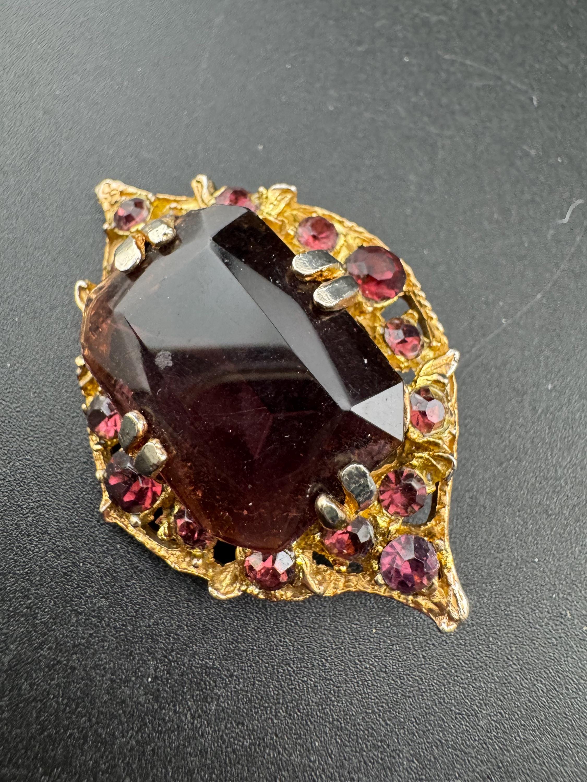 Chunky gold metal brooch with amethyst purple big central rhinestone glass diamanté cabochon