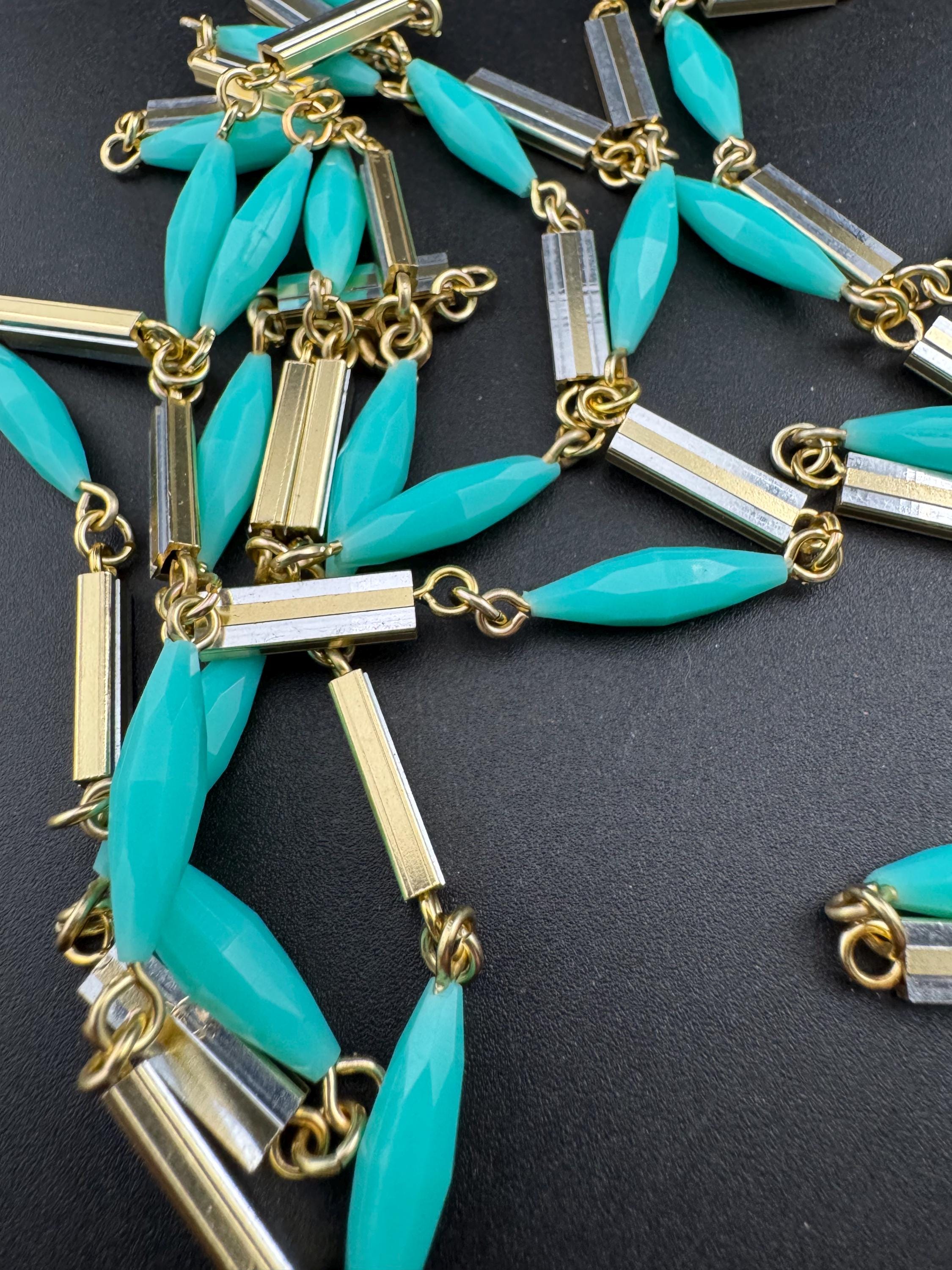 Vintage 60s 70s long plastic layering necklace. Turquoise blue beads with silver and gold tones
