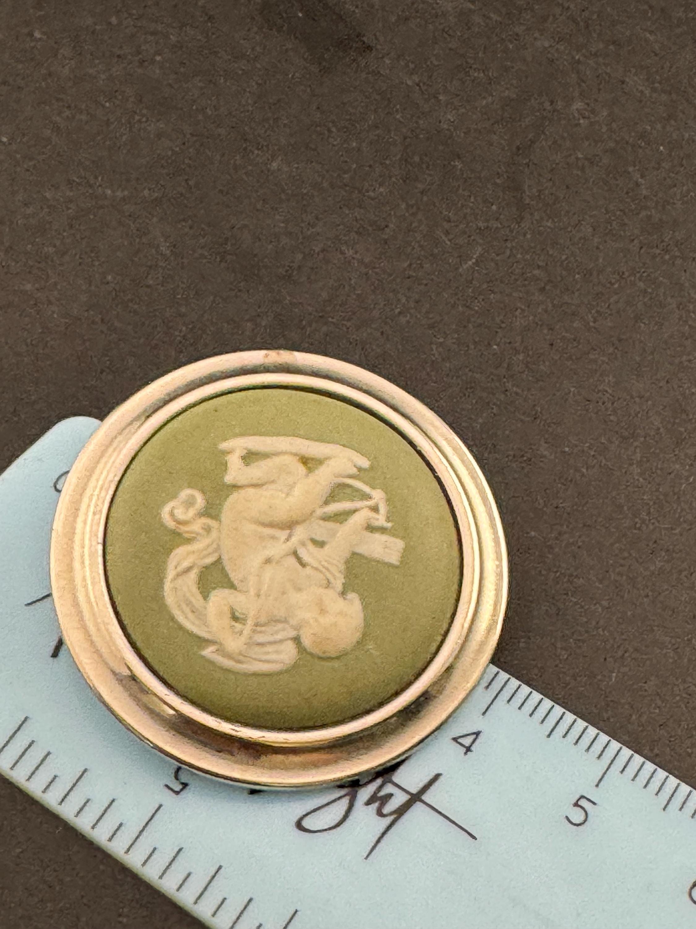 signed wedgwood green jasper ware  ceramic round cherub brooch with 925 silver surround