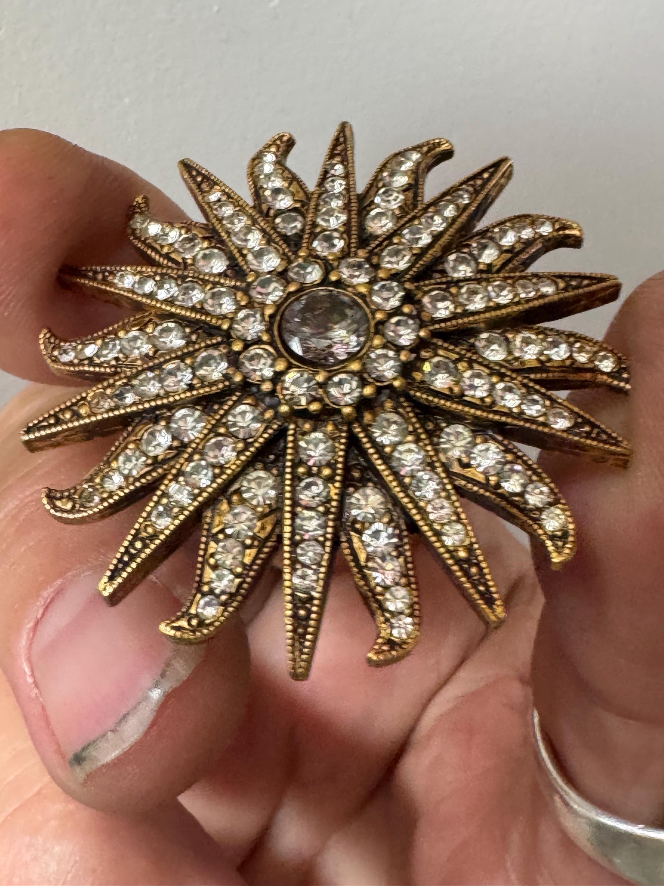 Vintage signed Smithsonian seal brooch. Large gold tone sun set with clear crystals