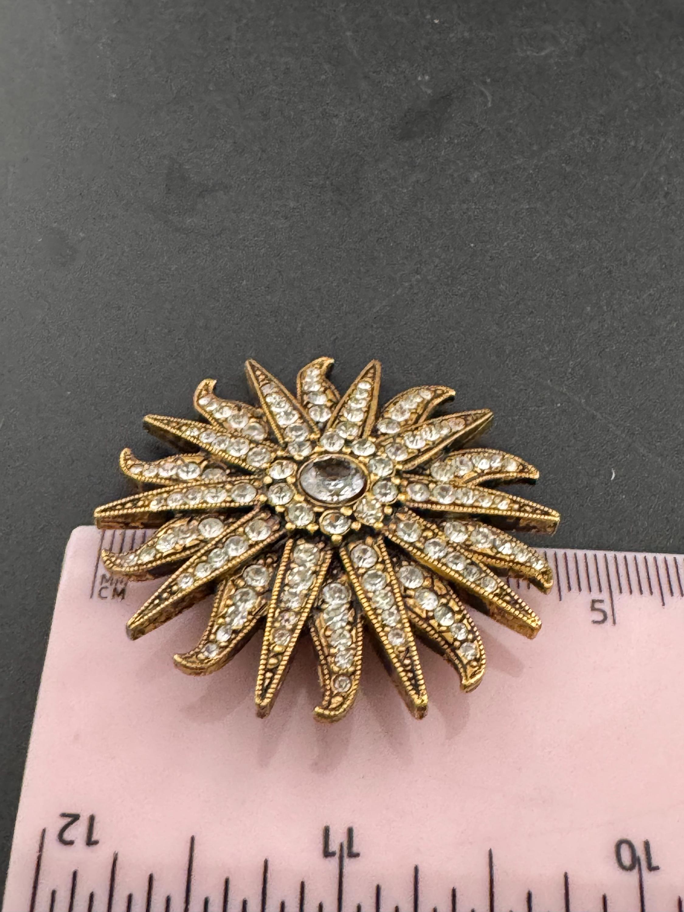 Vintage signed Smithsonian seal brooch. Large gold tone sun set with clear crystals