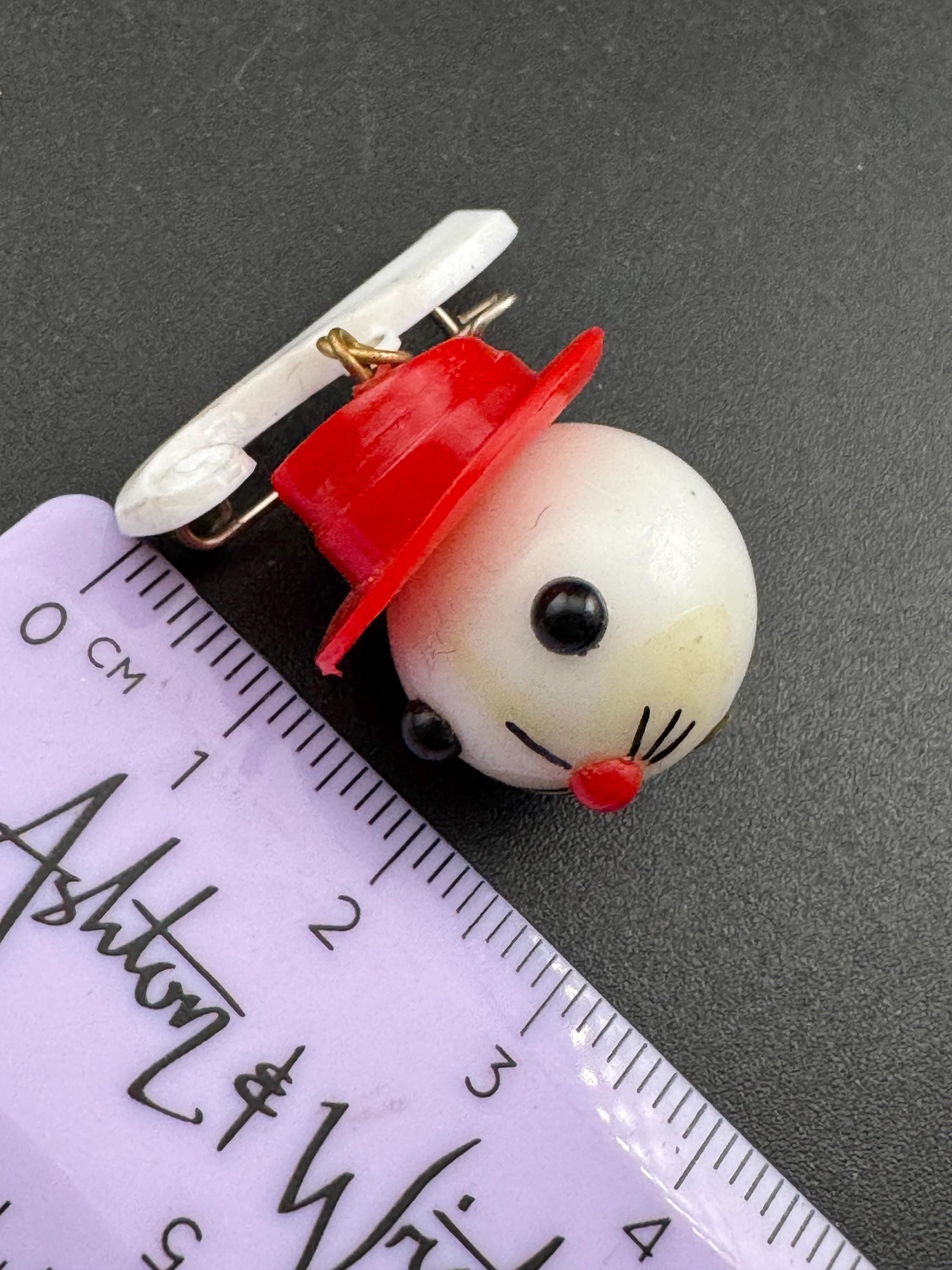 Vintage 1940s kitsch cute Early Plastic dangly rabbit or mouse in a red hat brooch