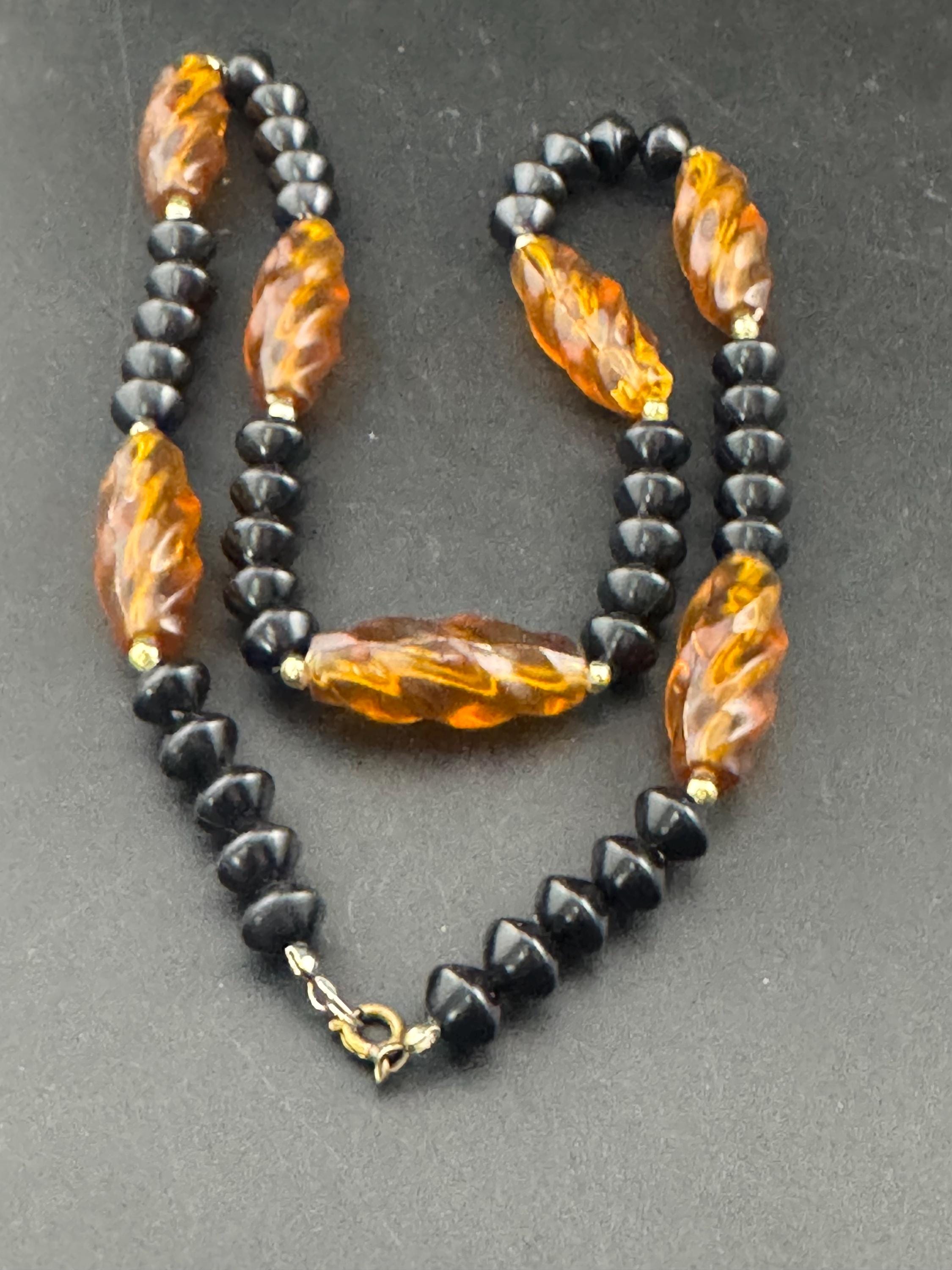 Long faux amber brown plastic beaded necklace with black beads 70s early 80s , 63cm