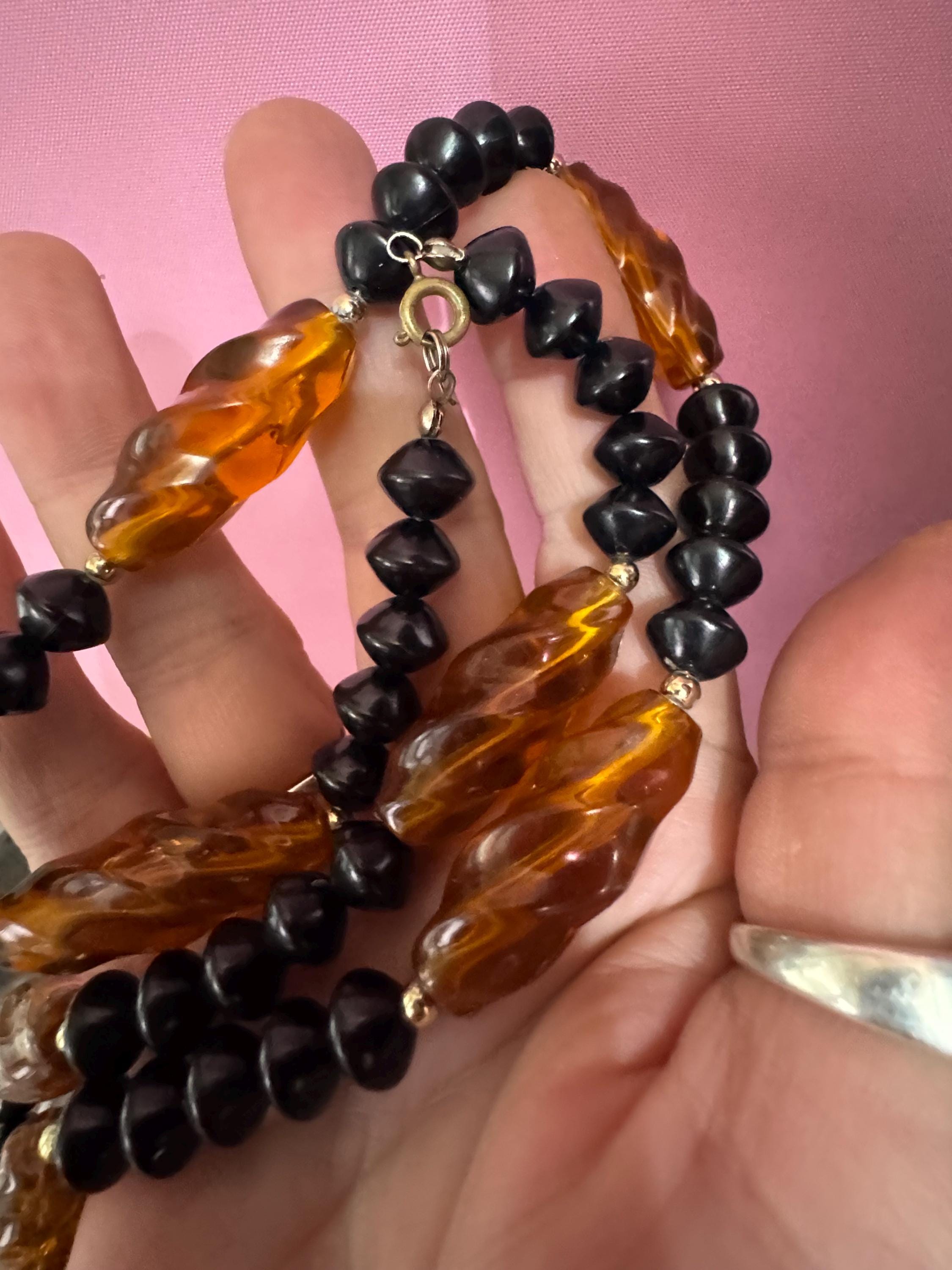 Long faux amber brown plastic beaded necklace with black beads 70s early 80s , 63cm