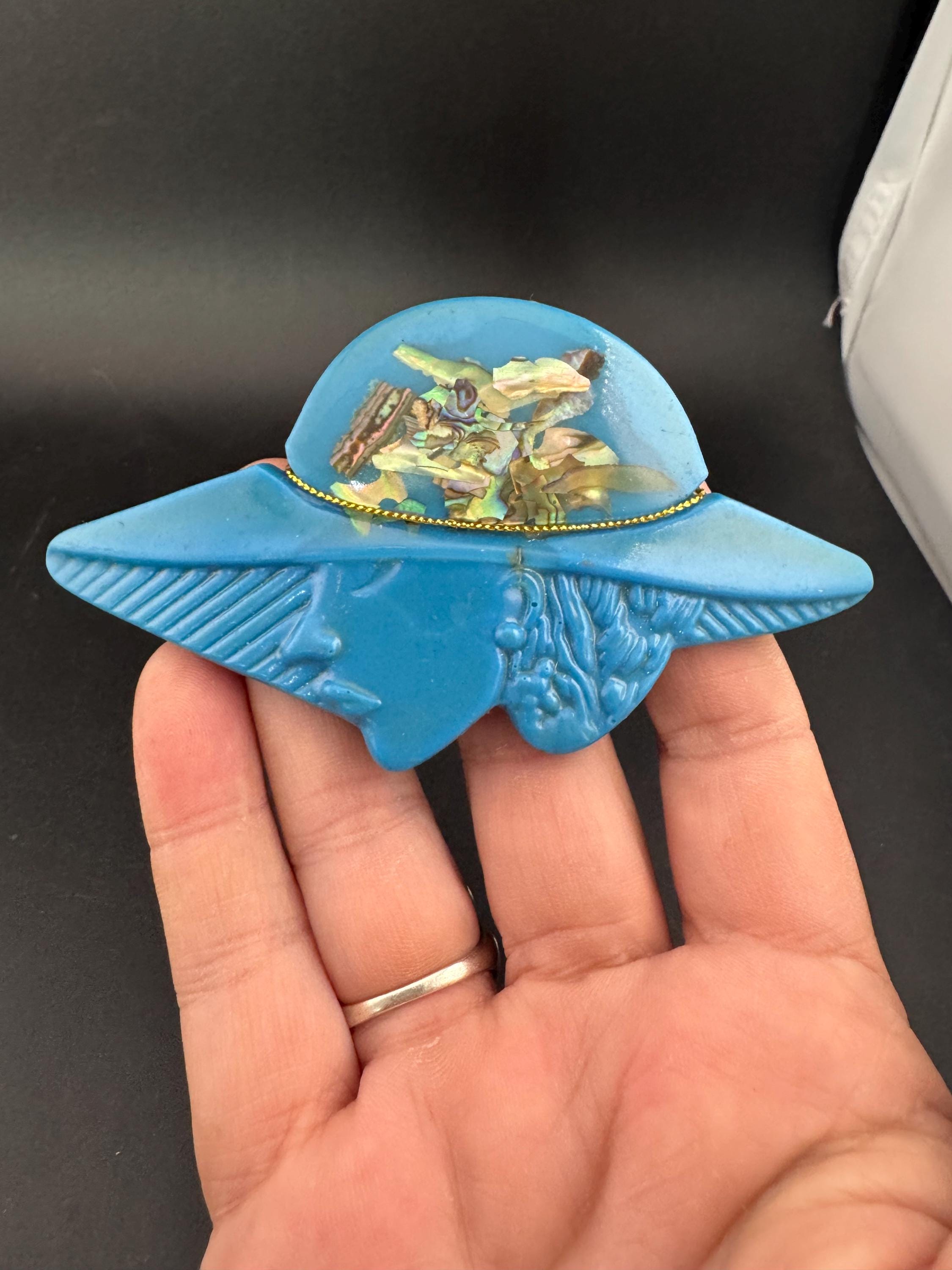 Oversized vintage lady in wide brimmed hat blue brooch inset with abalone shell, early plastic 1960s