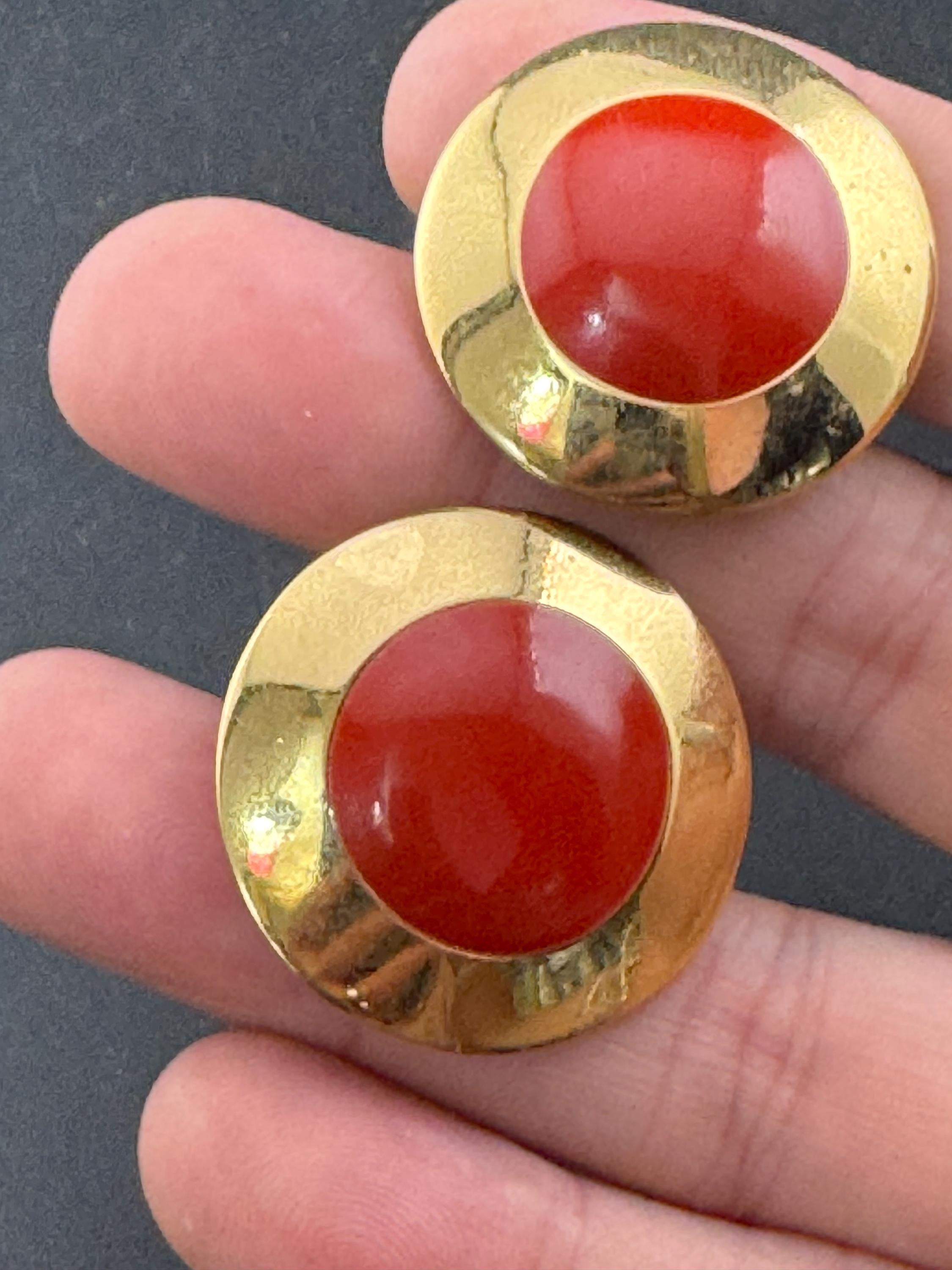 Signed MONET Gold tone deep red enamel low domed disc clip on earrings