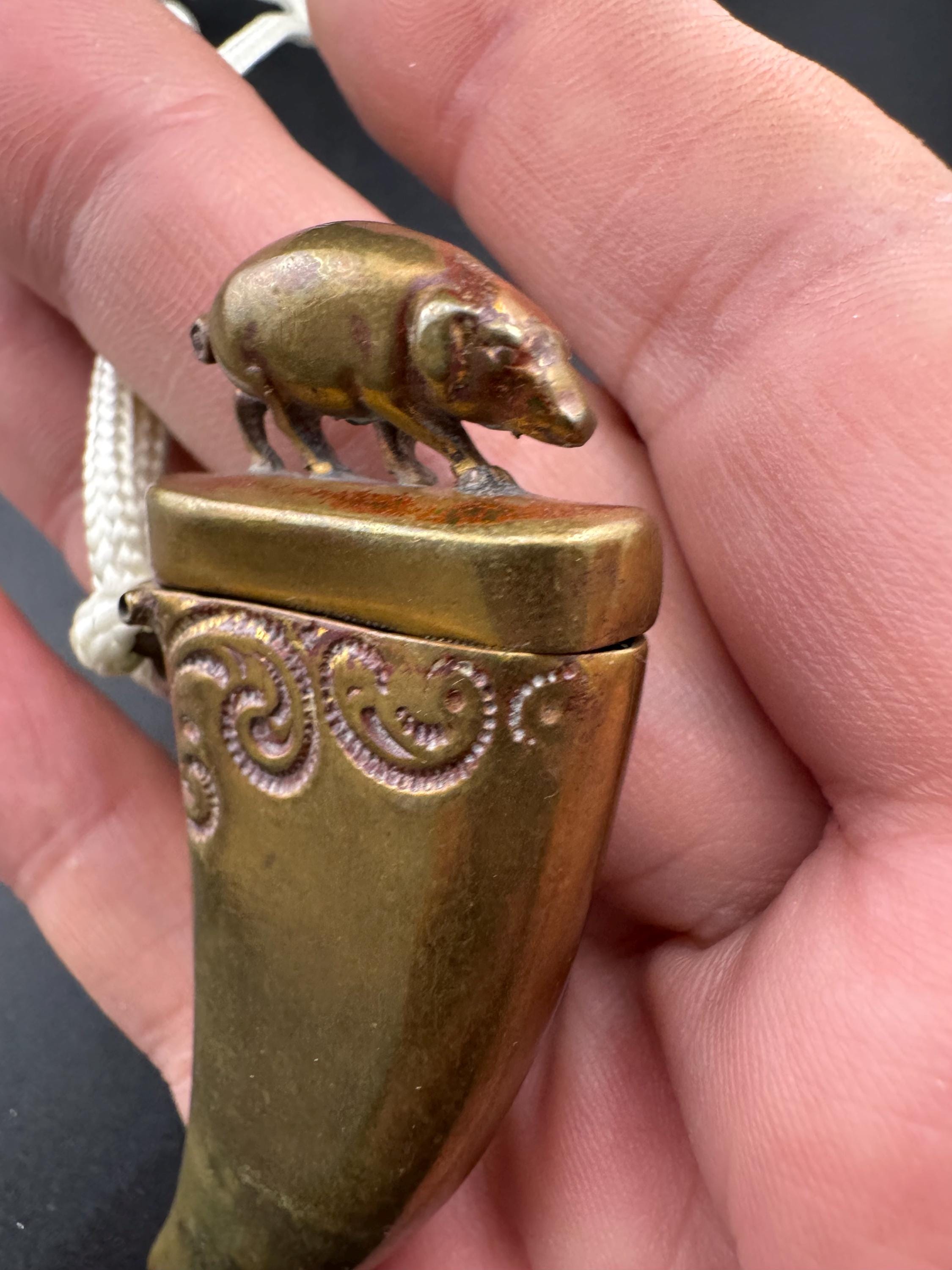 Antique brass novelty match vesta in the form of boar and tusk, antique match vesta case pendant