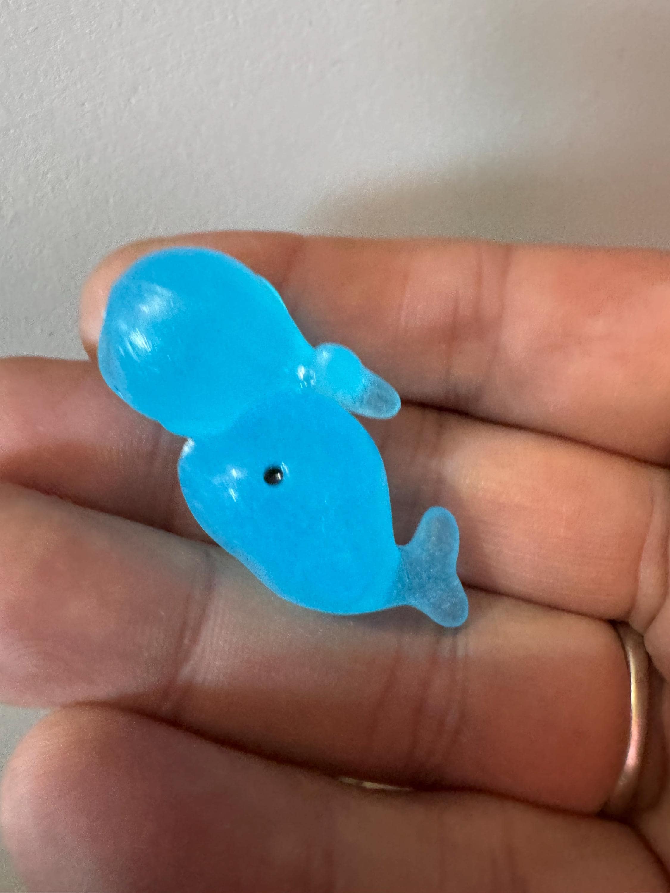 2 pieces of miniature glow in the dark blue sharks seaside cake topper