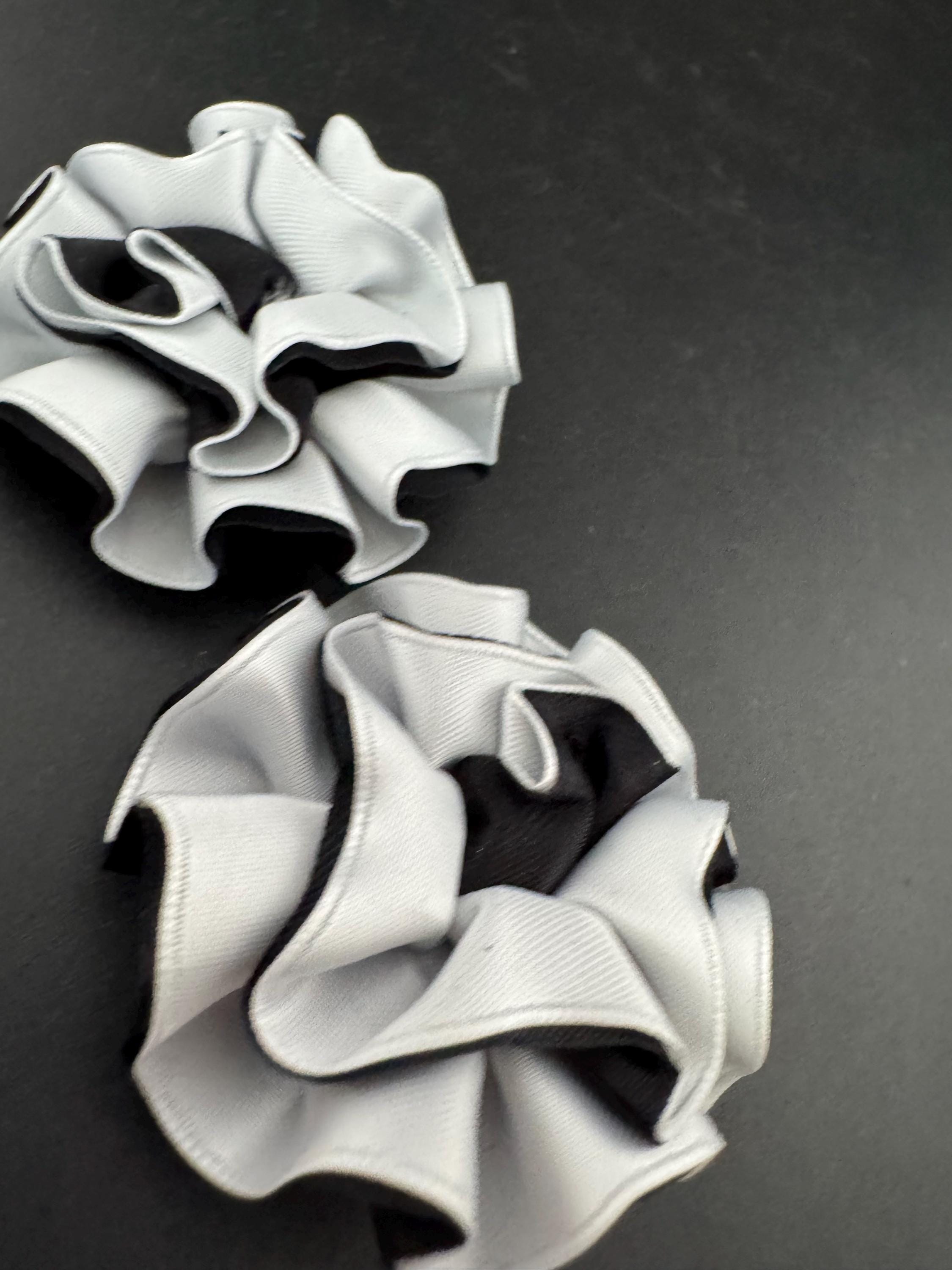 Vintage pair of black and white ribbon flower twist Pom Pom shoe clips trims 1980s
