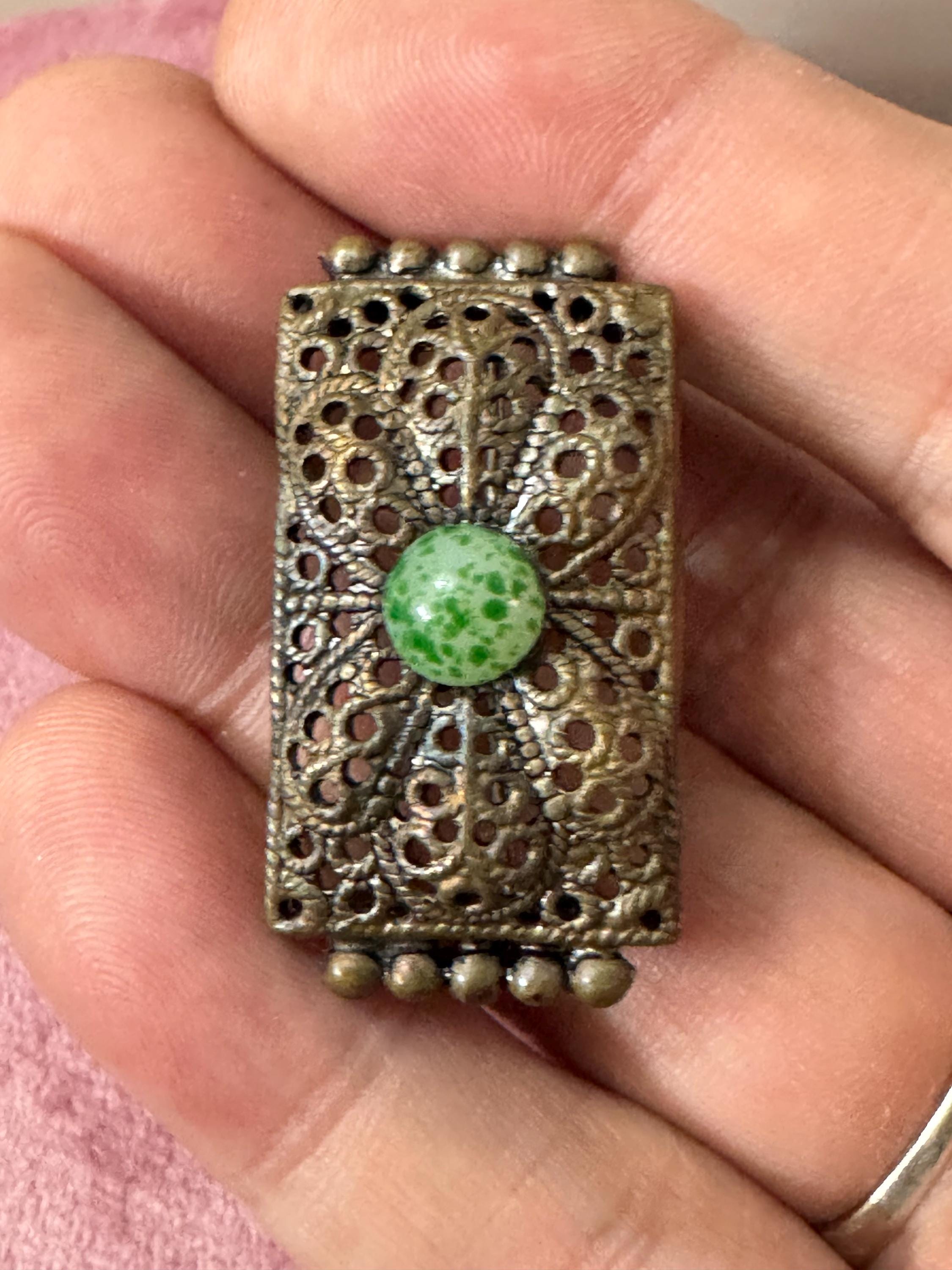Antique Czech gold tone brass metal Brooch set with a peking glass green cabochon