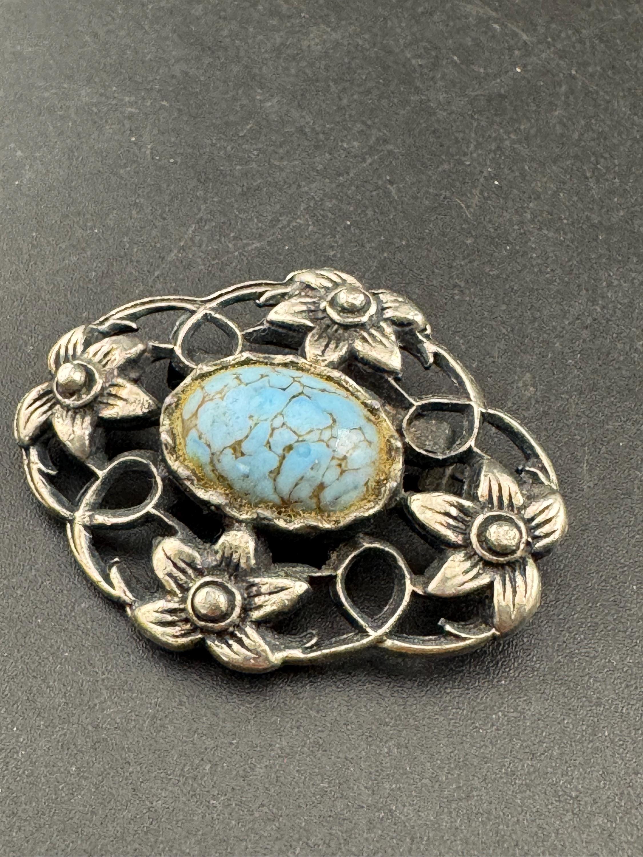 vintage silver tone ornate Scottish style brooch set with turquoise cabochon