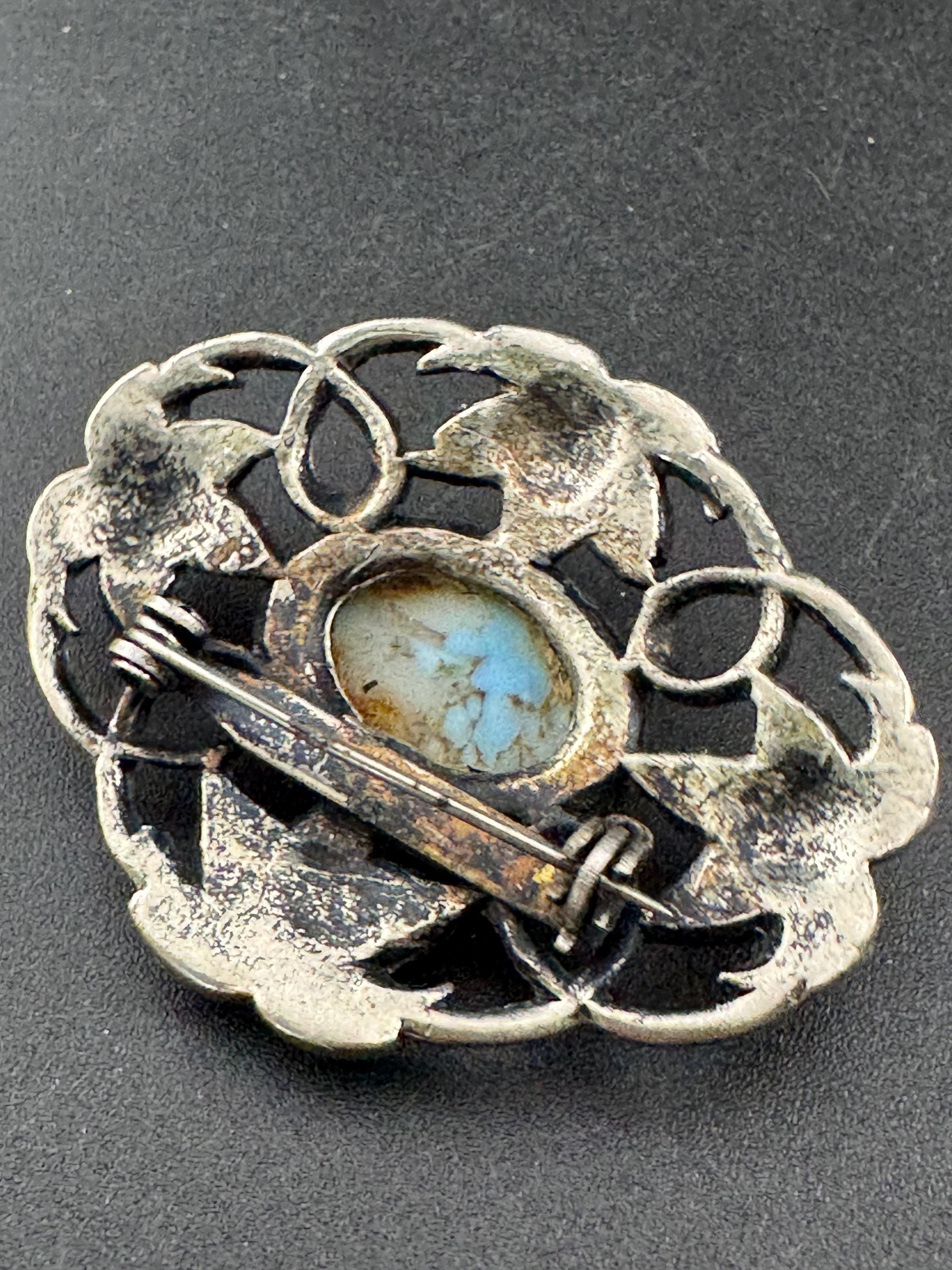 vintage silver tone ornate Scottish style brooch set with turquoise cabochon