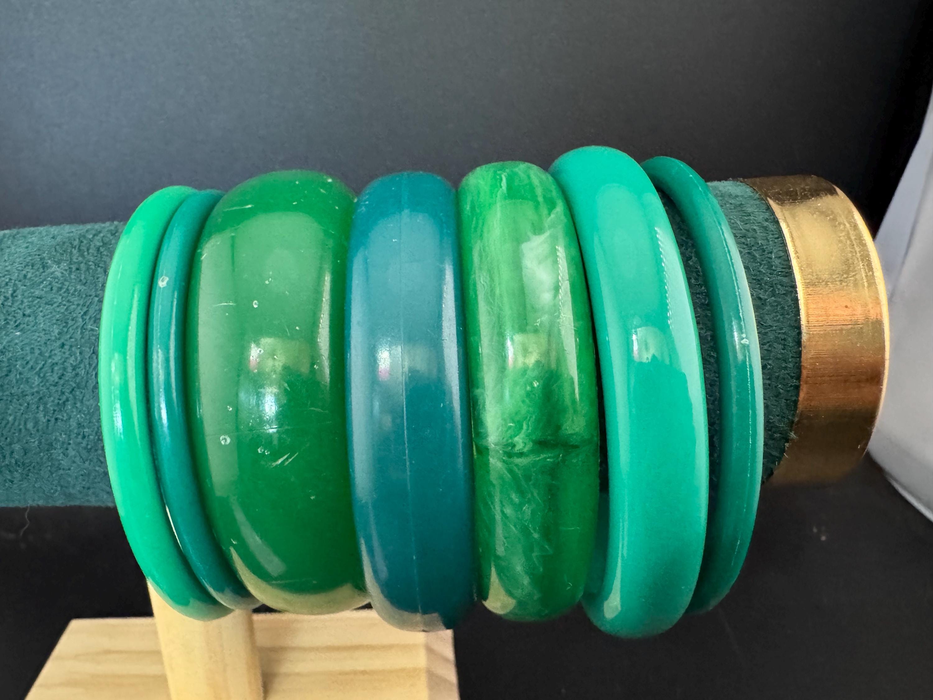 Vintage and retro curated stack of GREEN plastic acrylic bangles, bracelets