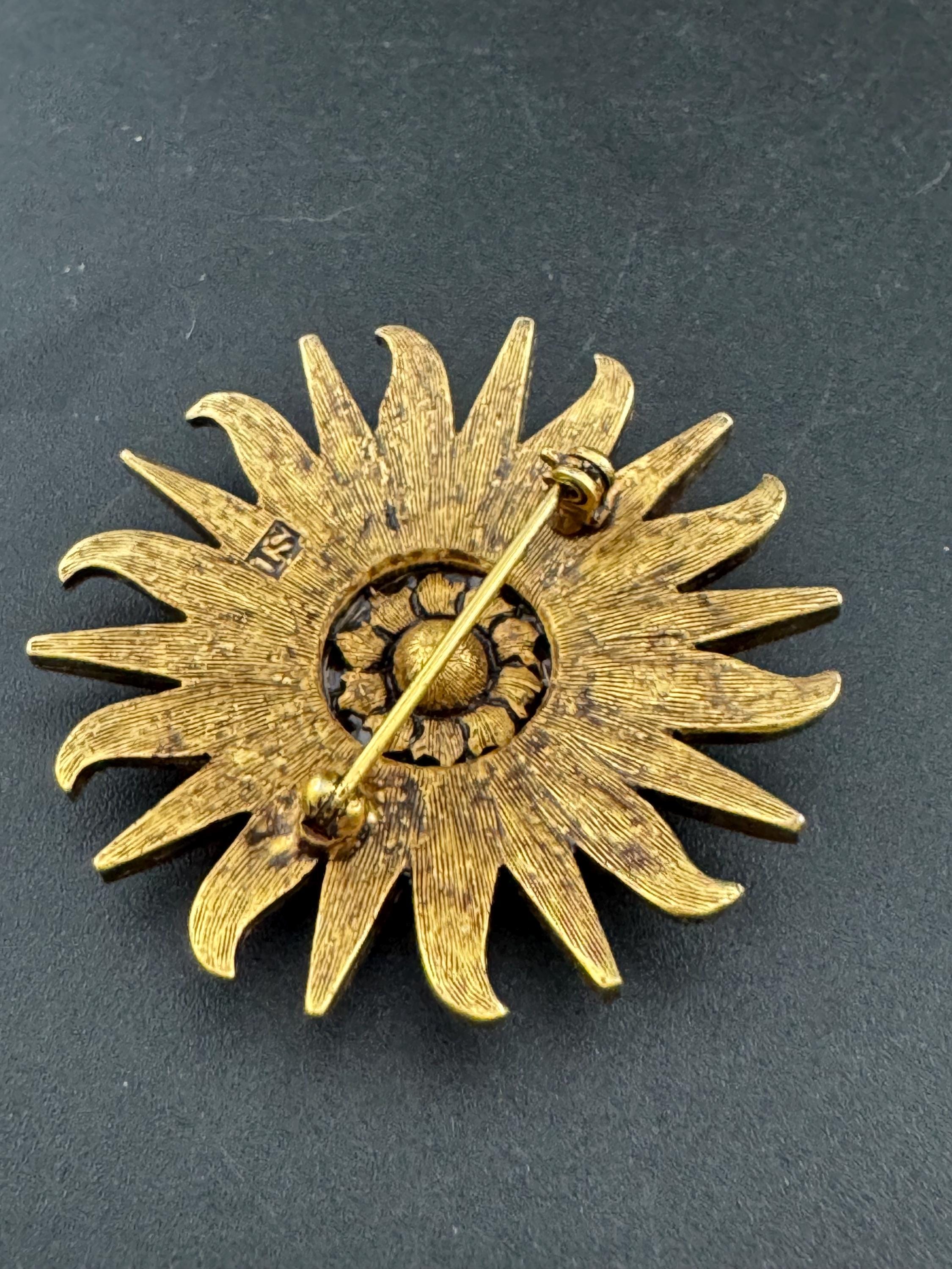 Vintage signed Smithsonian seal brooch. Large gold tone sun set with clear crystals
