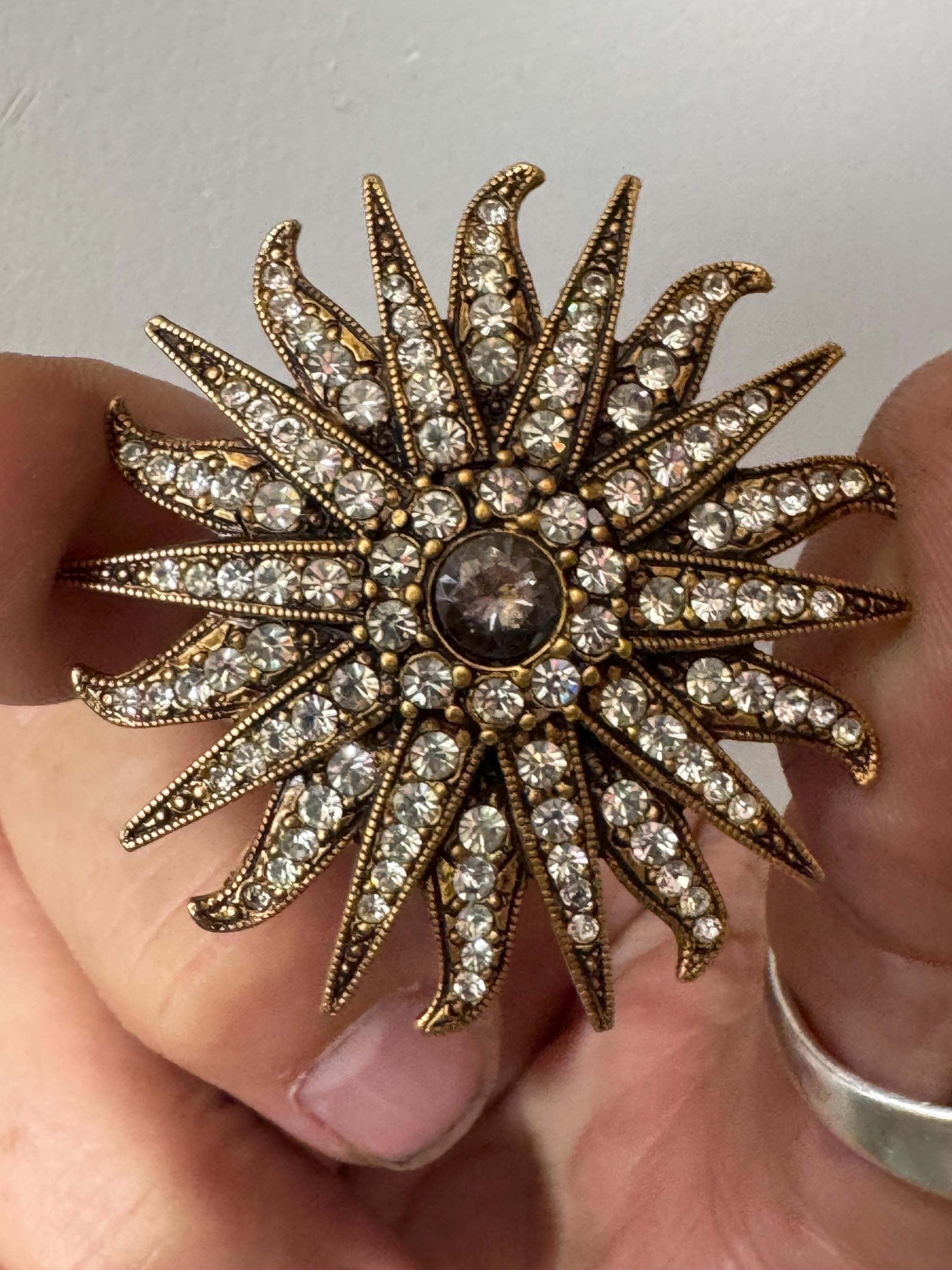 Vintage signed Smithsonian seal brooch. Large gold tone sun set with clear crystals