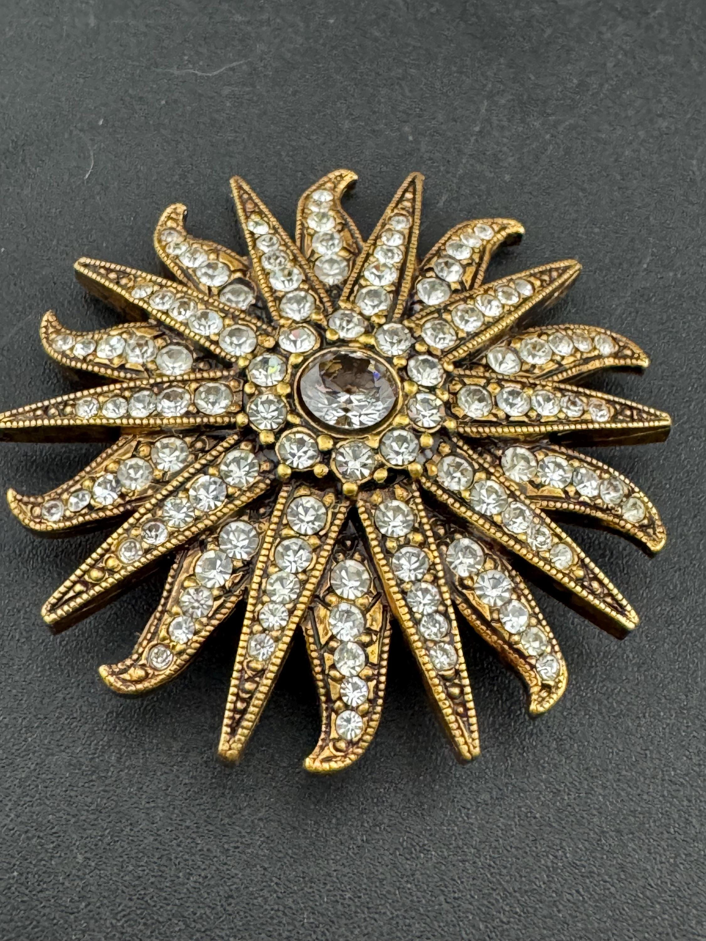 Vintage signed Smithsonian seal brooch. Large gold tone sun set with clear crystals