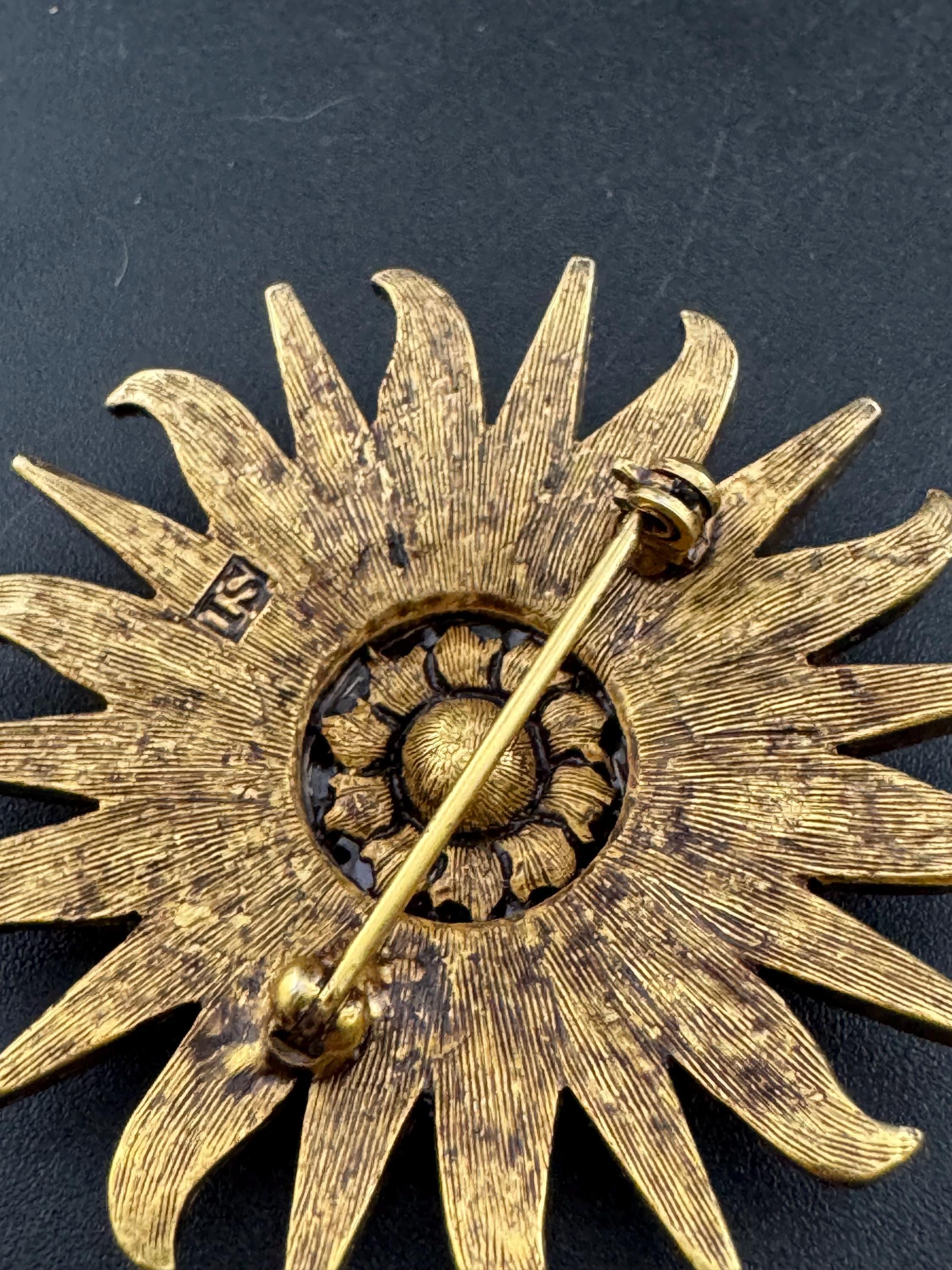 Vintage signed Smithsonian seal brooch. Large gold tone sun set with clear crystals